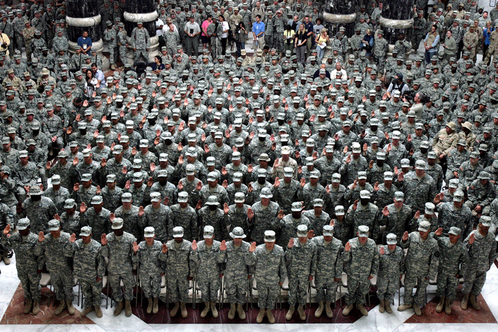 Newly naturalized U.S. soldiers attend a ceremony at Camp Victory in Baghdad.