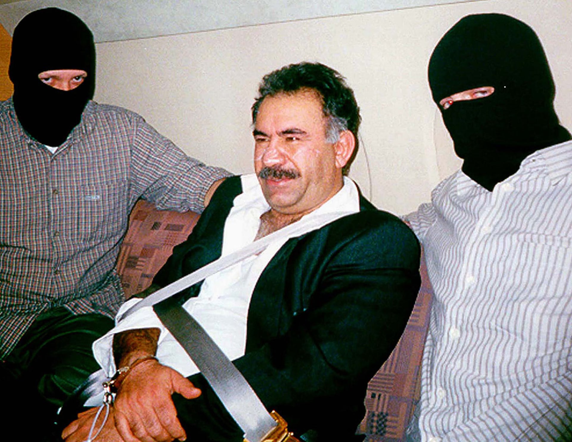 Turkish special forces flank a bound and handcuffed Abdullah Ocalan, who was captured in Kenya. Ocalan was flown to Turkey, where he was convicted of treason.
