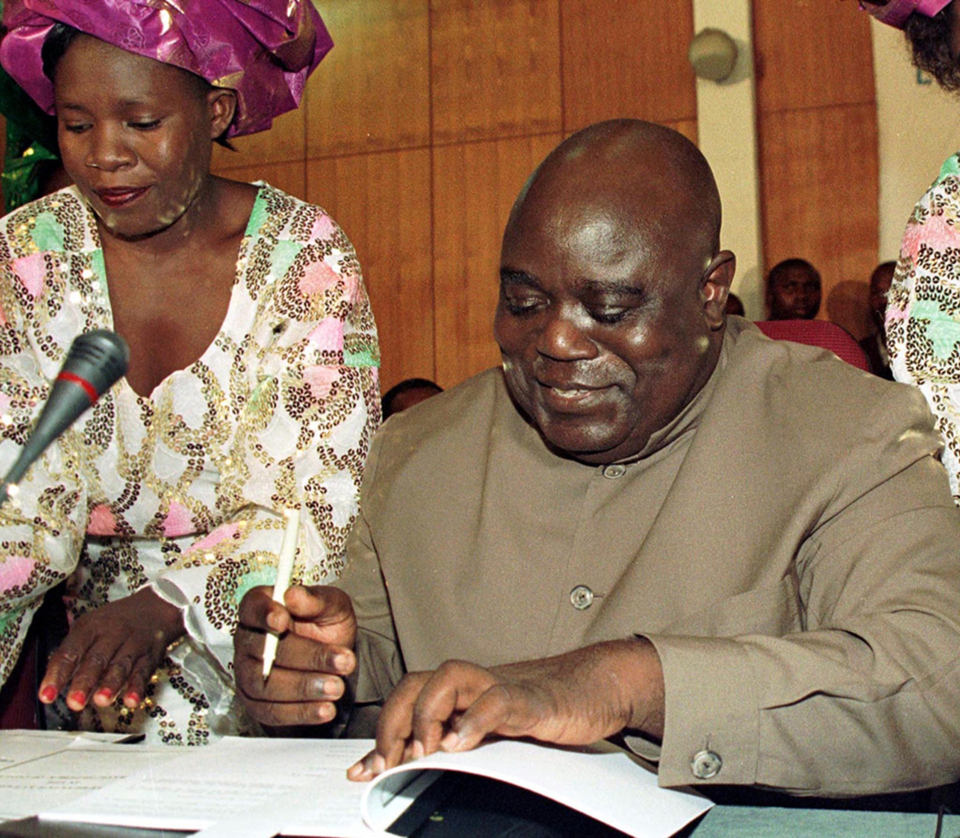 Kabila signs cease-fire documents in Lusaka, Zambia, on July 10, 1999. Howard Burditt/Reuters