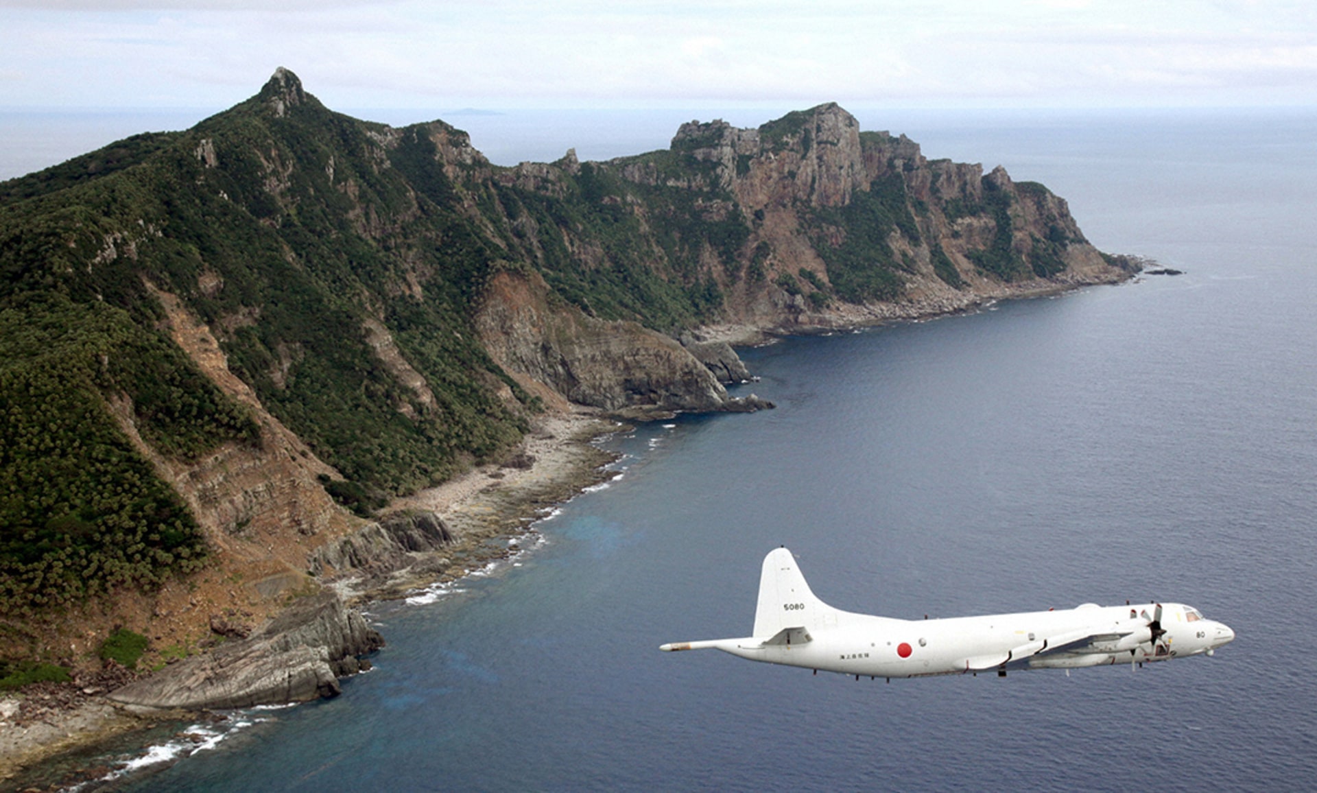 A Japan Maritime Self-Defense Force surveillance plane flies around the Senkaku/Diaoyu Islands in the East China Sea. Kyodo/Reuters