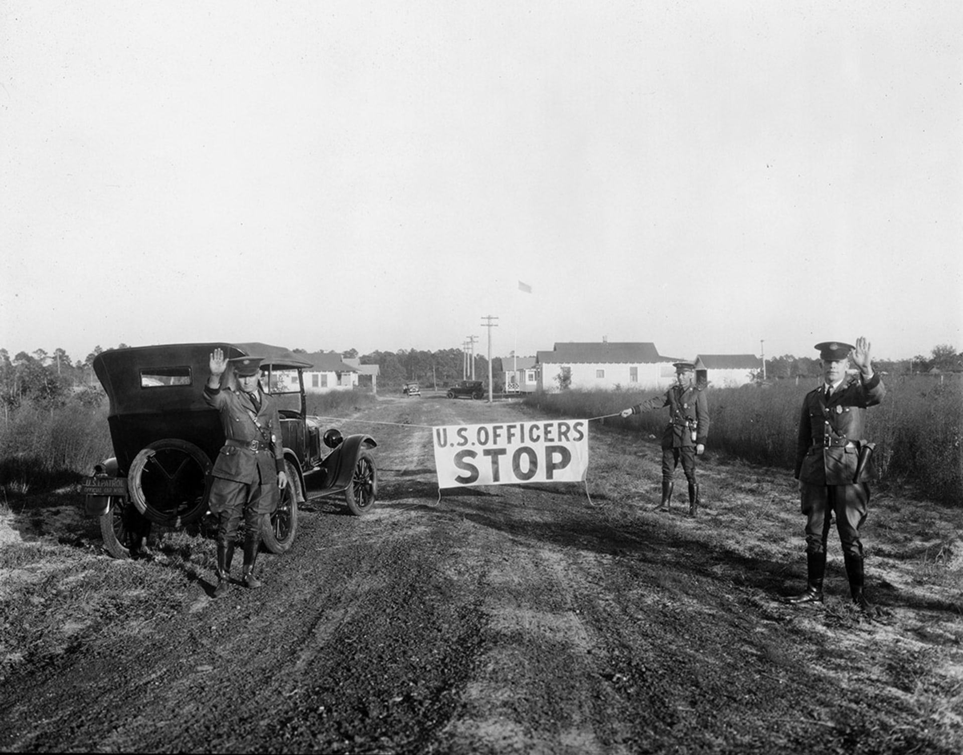 U.S. Border Patrol agents block a road in Gainesville, Florida, in 1926. National Archives
