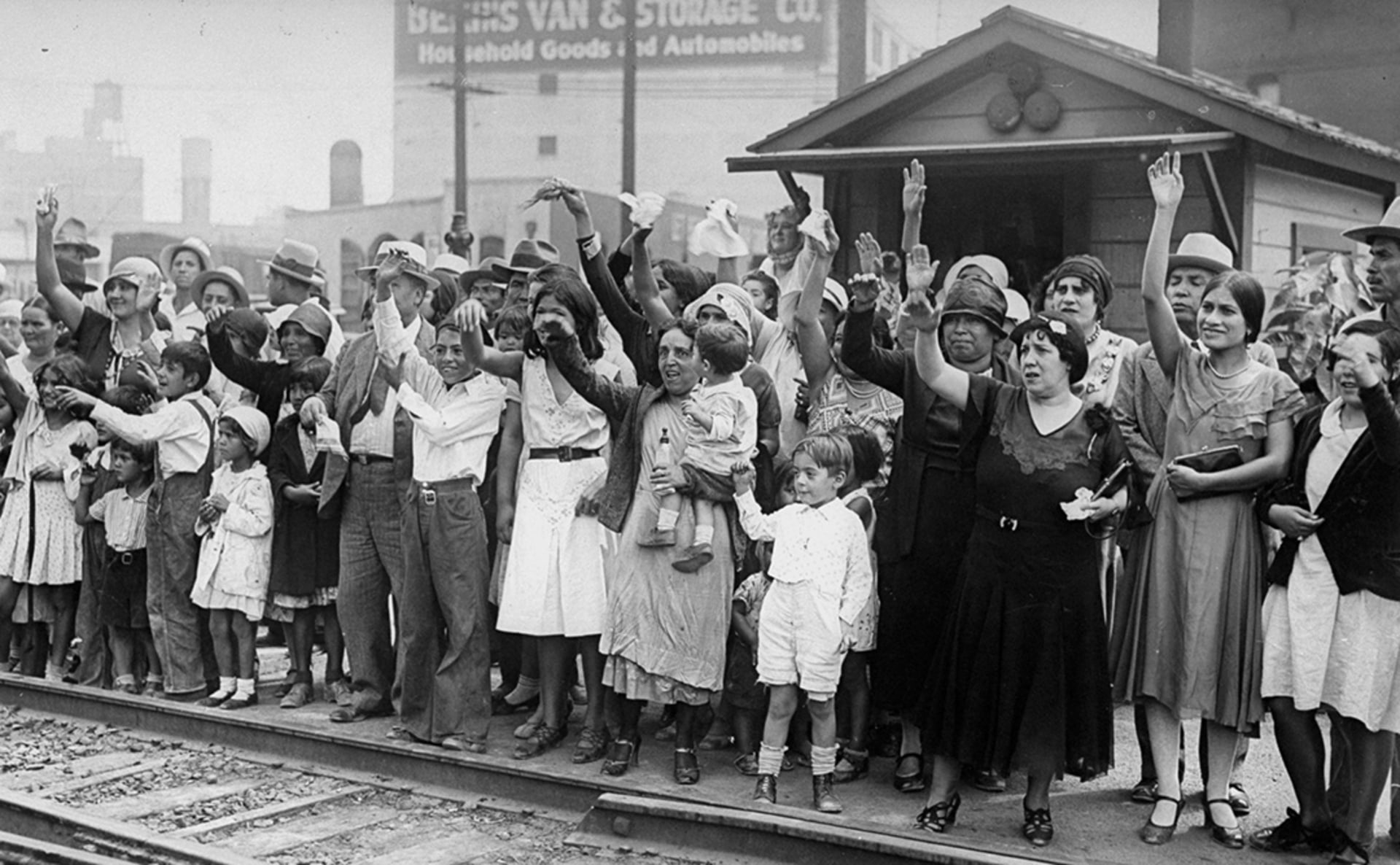Friends and family wave goodbye to Mexicans who are being expelled back to Mexico as the United States begins a national repatriation program. New York Daily News Archive/Getty Images