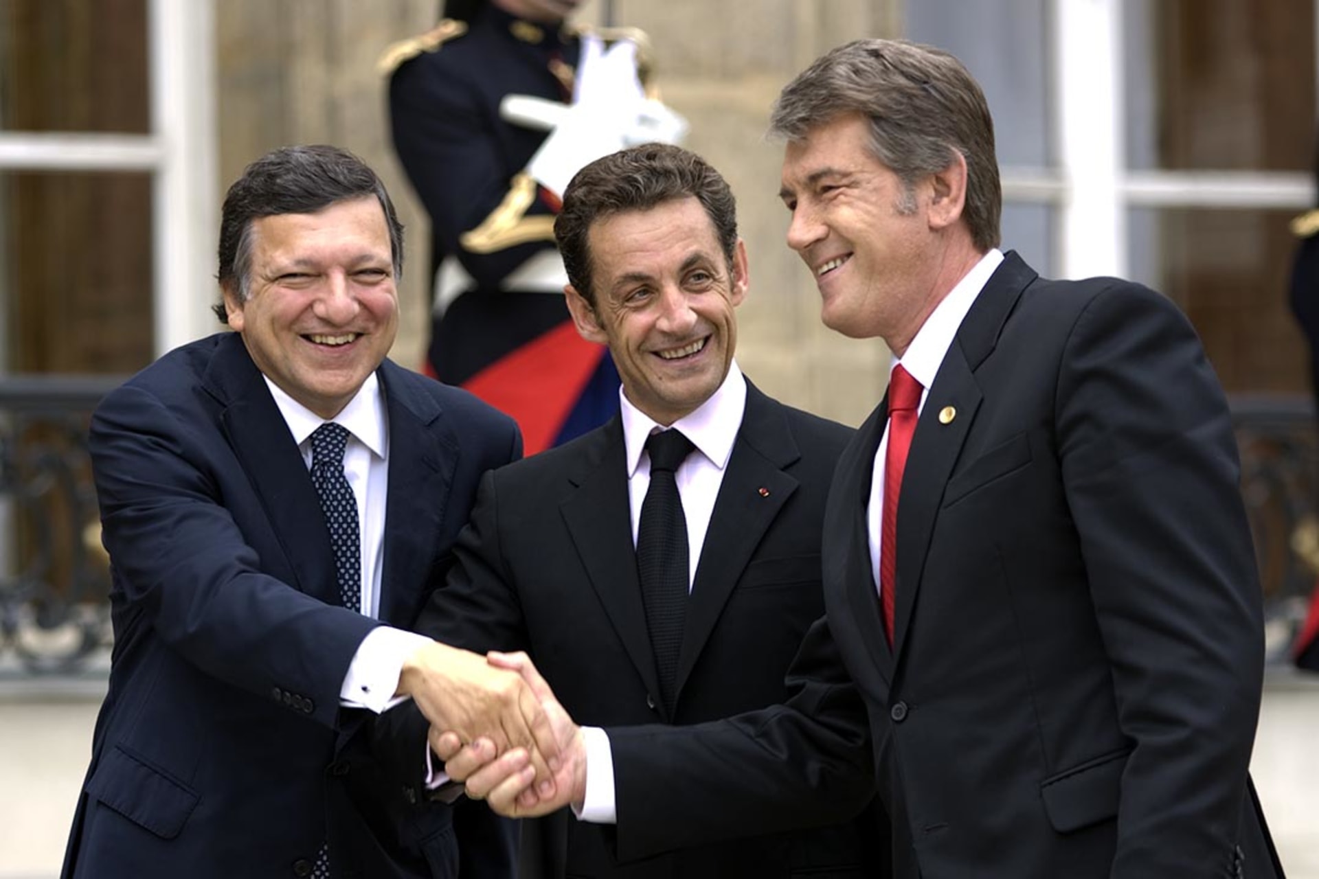 European Commission President Jose-Manuel Barroso, French President Nicolas Sarkozy, and Ukrainian President Viktor Yushchenko greet before an EU-Ukraine summit in Paris. 
