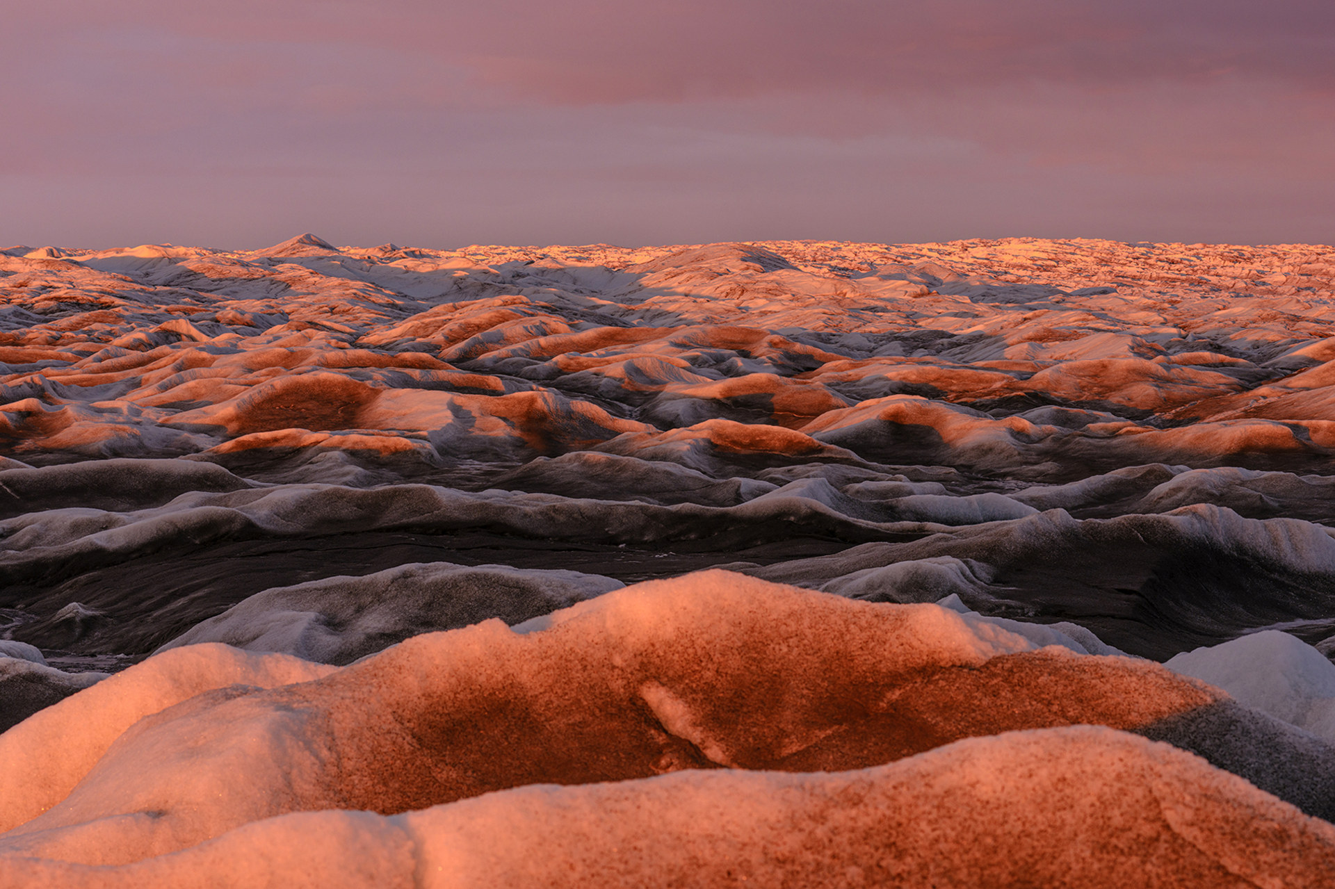View of the ice sheet in Greenland under the midnight sun.