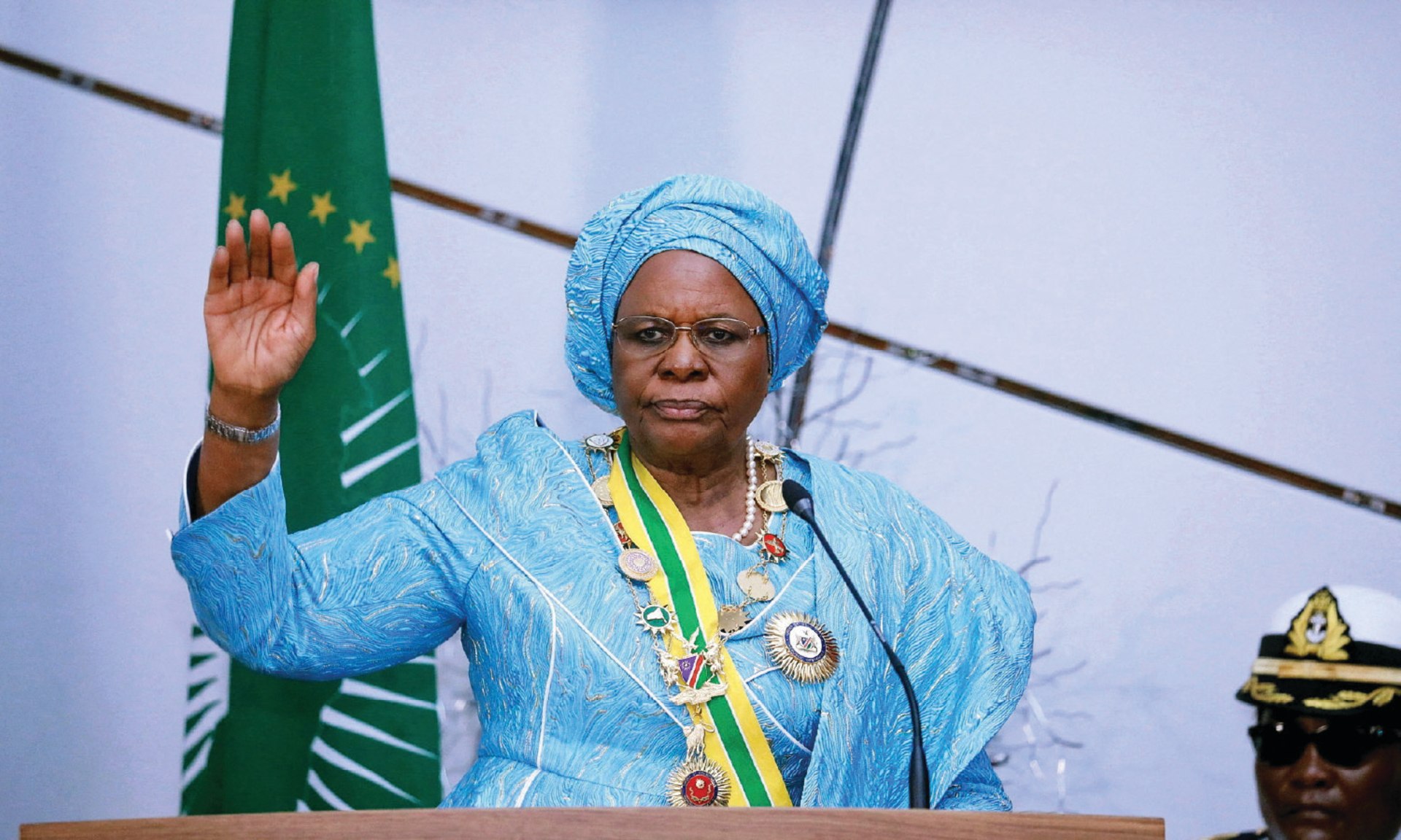 Namibia's first female President, Netumbo Nandi-Ndaitwah raises her hand during her inauguration at the State House in Windhoek, Namibia, on March 21, 2025.