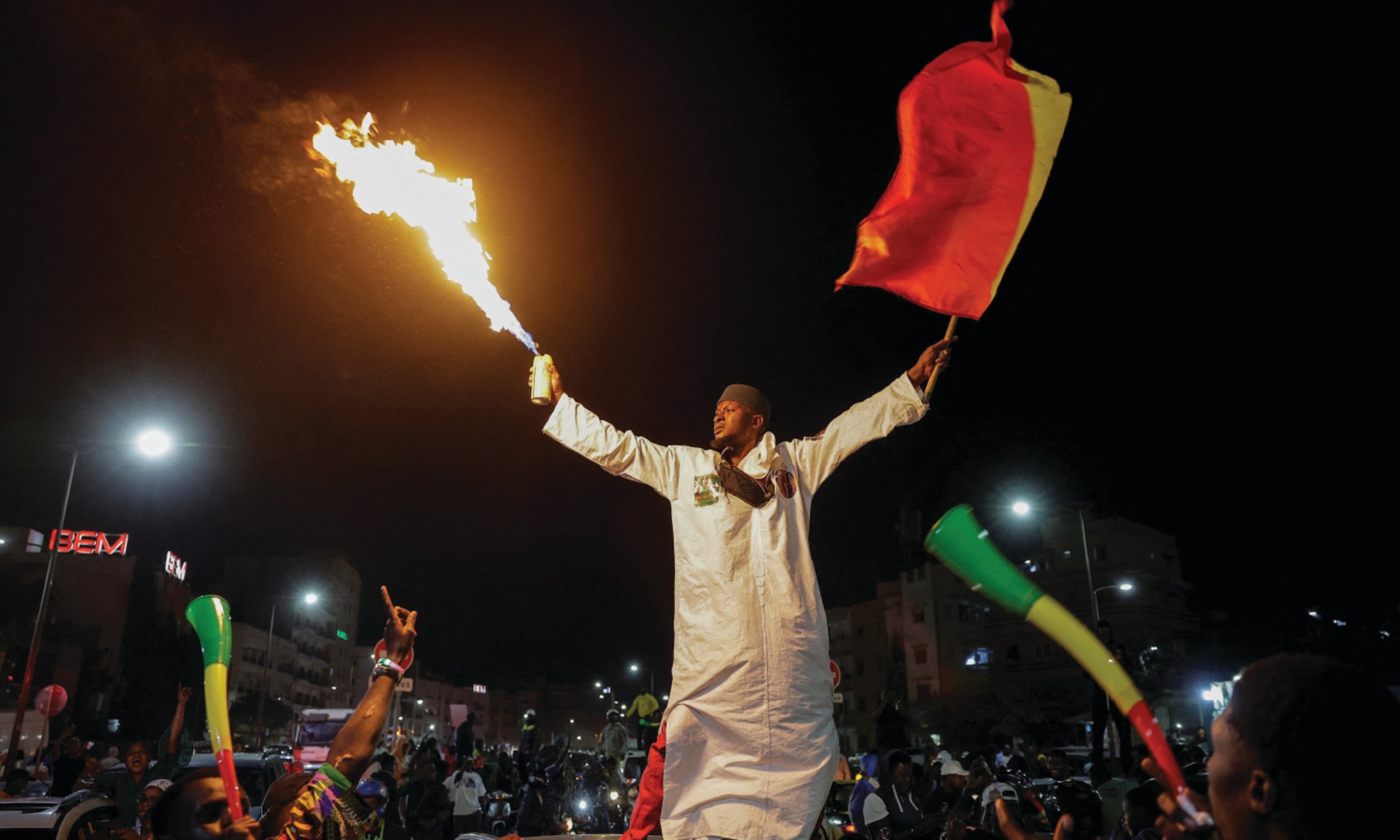 A supporter celebrates after Senegalese opposition leader Ousmane Sonko and the presidential candidate he is backing in the March 24 election, Bassirou Diomaye Faye, were released from prison, in Dakar, Senegal on March 14, 2024. 