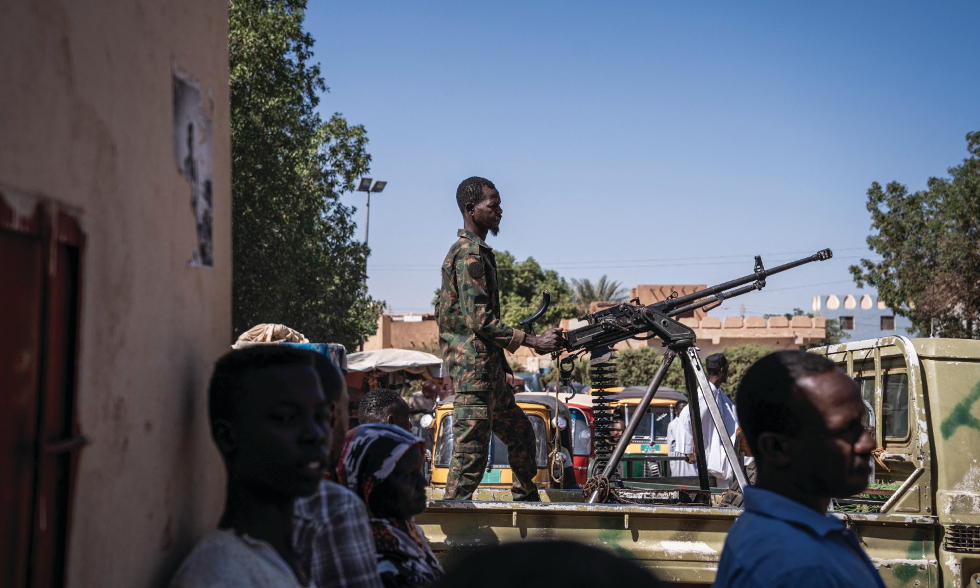 A Sudanese army soldier mans a machine gun on top of a military pickup truck outside a hospital in Omdurman, Sudan on November 2, 2024.