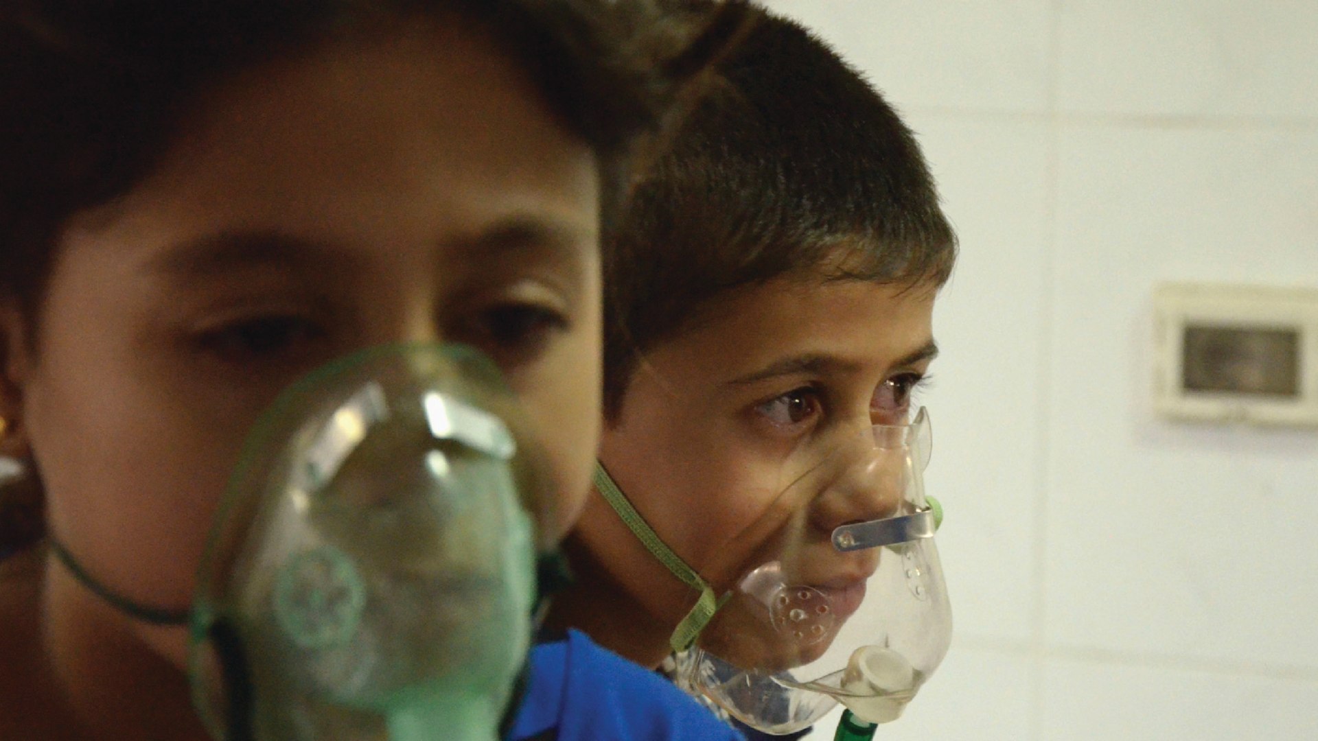 Children, affected by an apparent gas attack, breathe through oxygen masks in Damascus, Syria, on August 21, 2013.