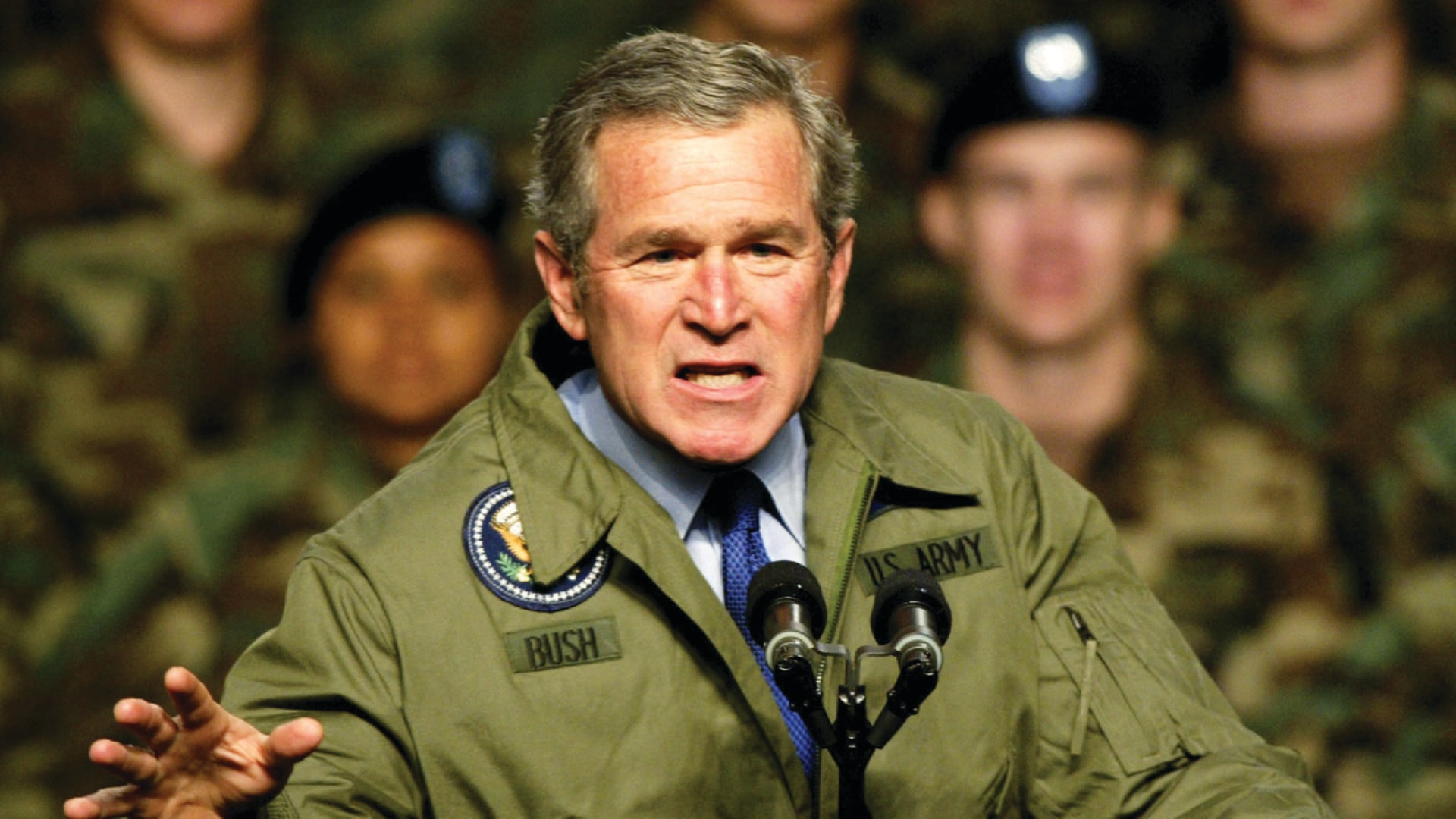 President George W. Bush wears a U.S. Army jacket while he addresses U.S. Army soldiers at Fort Hood, Texas.