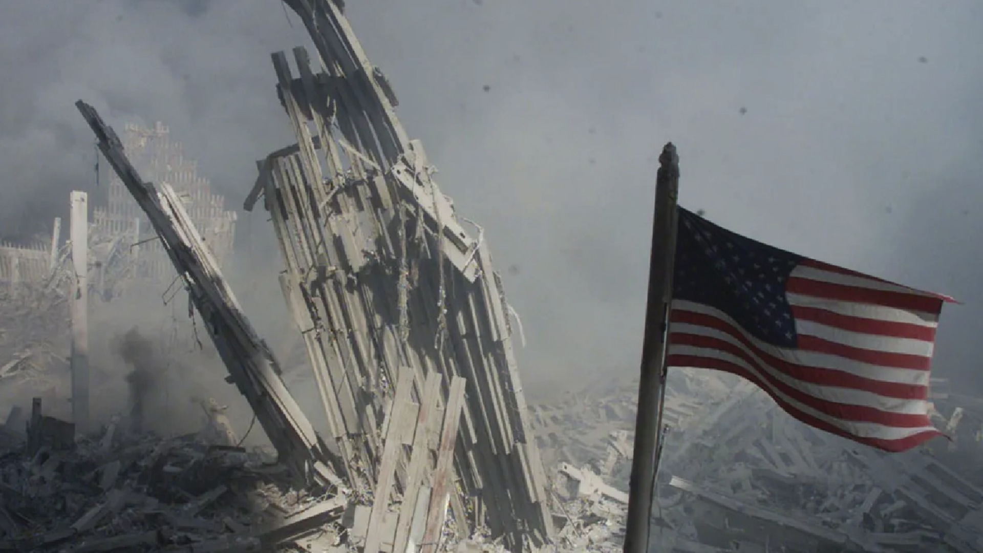 An American flag flies near the base of the destroyed World Trade Center in New York on September 11, 2001.