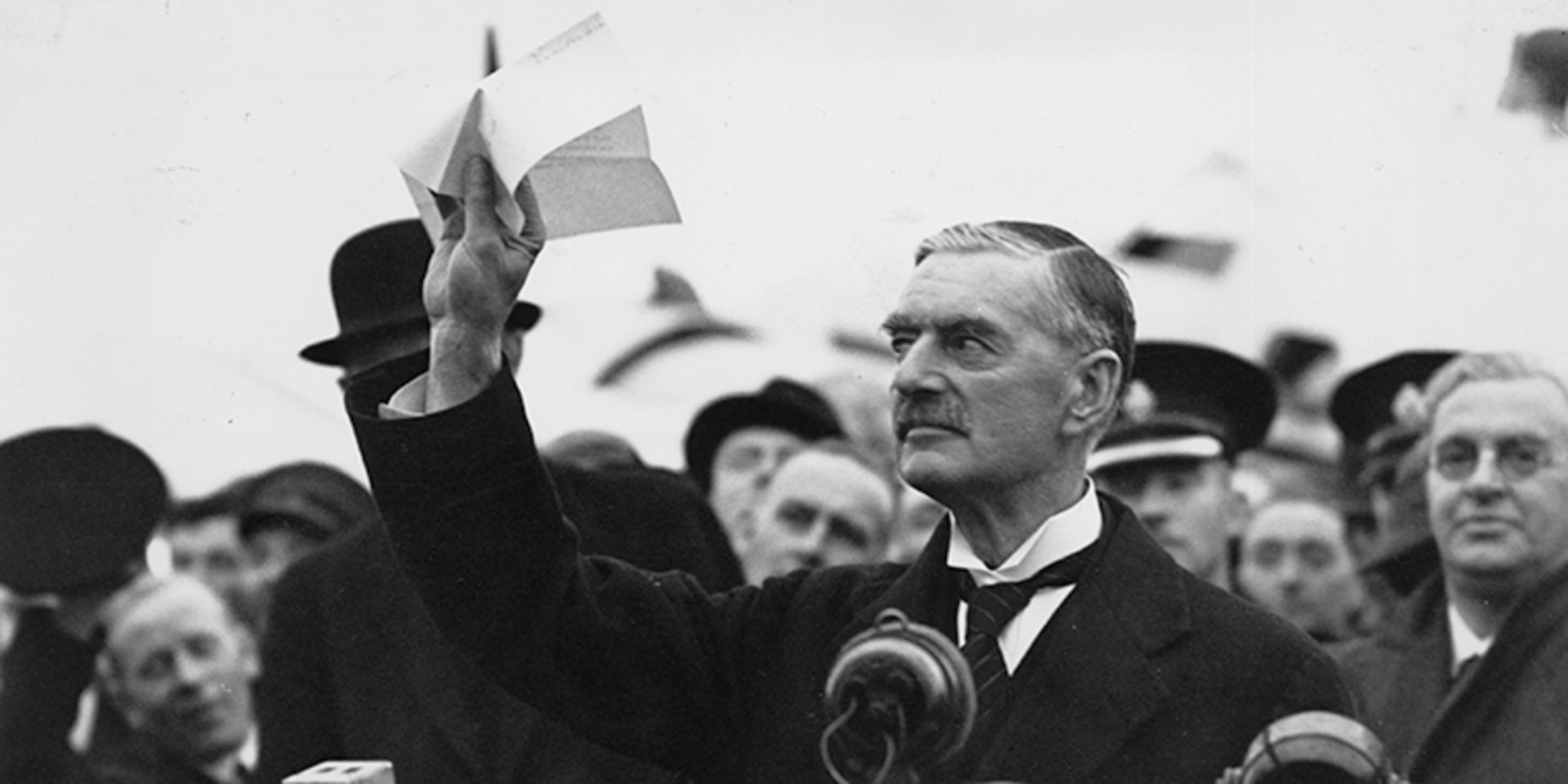 British Prime Minister Neville Chamberlain at Heston Airport in London on his return from Munich after meeting with Hitler, making his ”Peace for Our Time” address, on September 30, 1938.