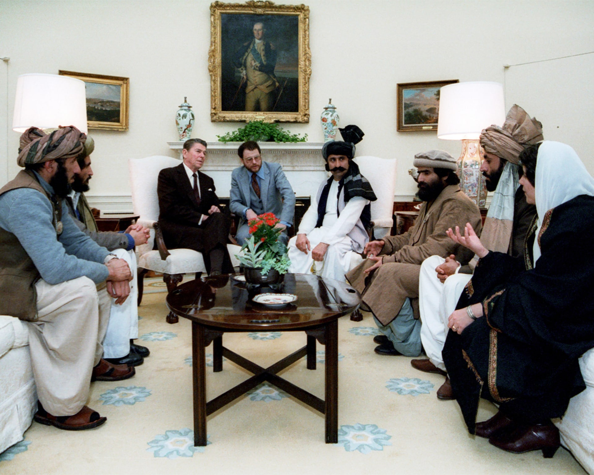 U.S. President Ronald Reagan meets with Afghan Mujahideen as they all sit down to discuss the Soviet invasion of Afghanistan.