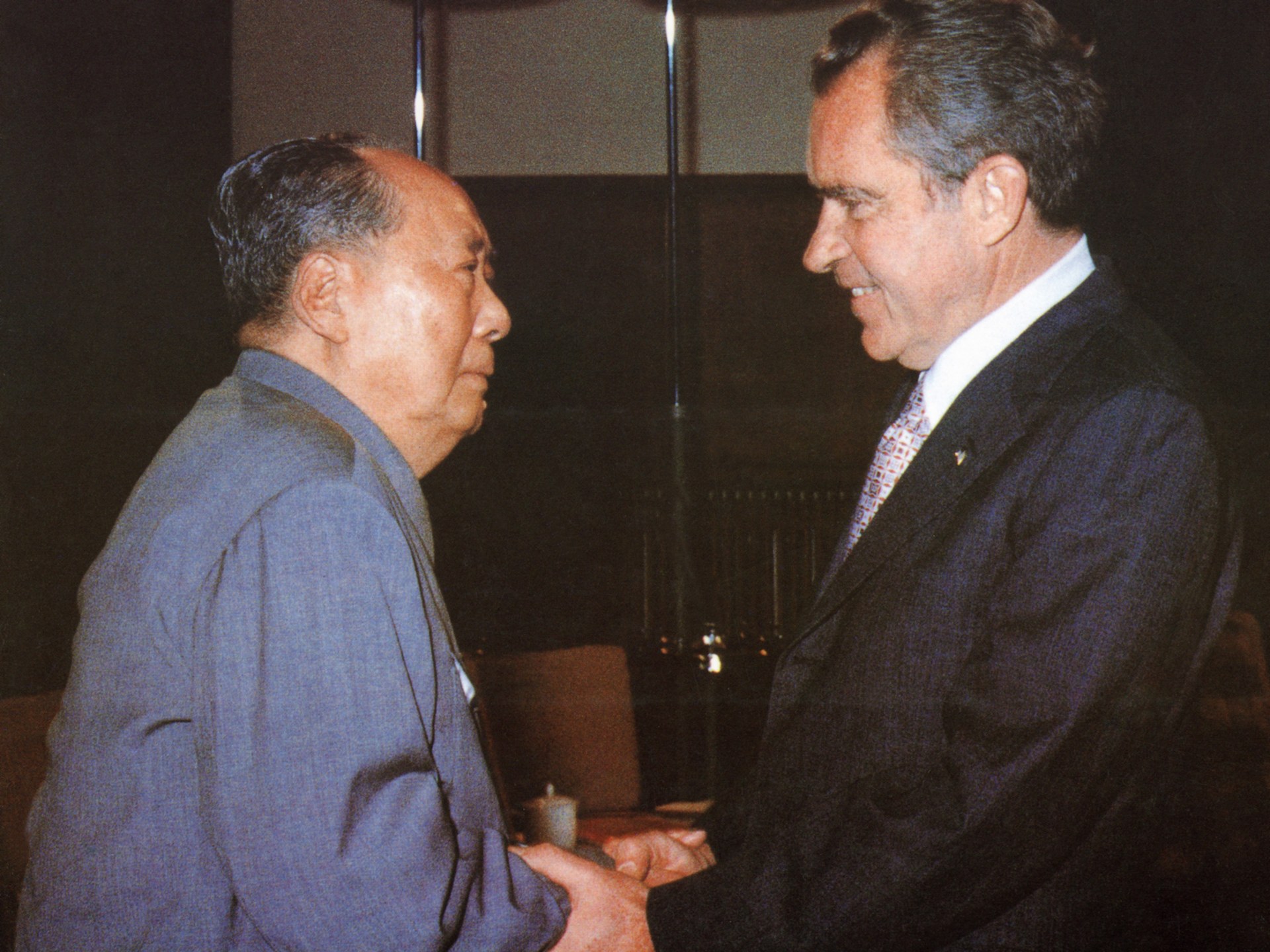 Chinese communist leader Chairman Mao Zedong welcomes U.S. President Richard Nixon to his house in Beijing with a handshake.