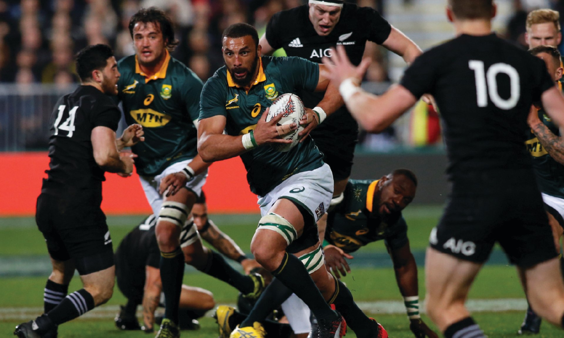 South Africa's Springboks player Uzair Cassiem charges through New Zealand's All Blacks rugby team during the Rugby Championship match in Auckland, New Zealand, on September 16, 2017.