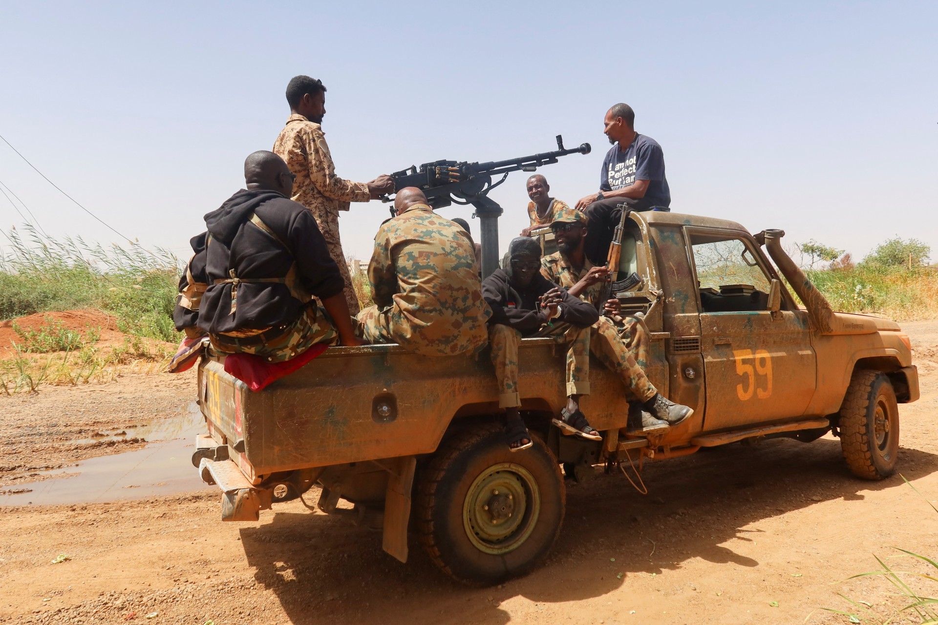 Members of Sudanese armed forces sit on an army vehicle in Omdurman, Sudan, on March 9, 2024.