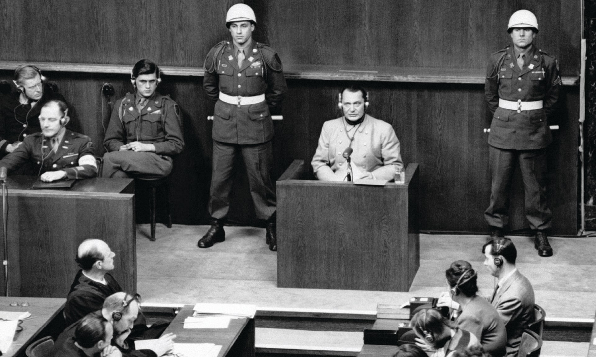 Nazi leader Hermann Goering sits in the defendent box accused of crimes against humanity, among other charges, at the Nuremberg Trials in Germany on March 16, 1946.