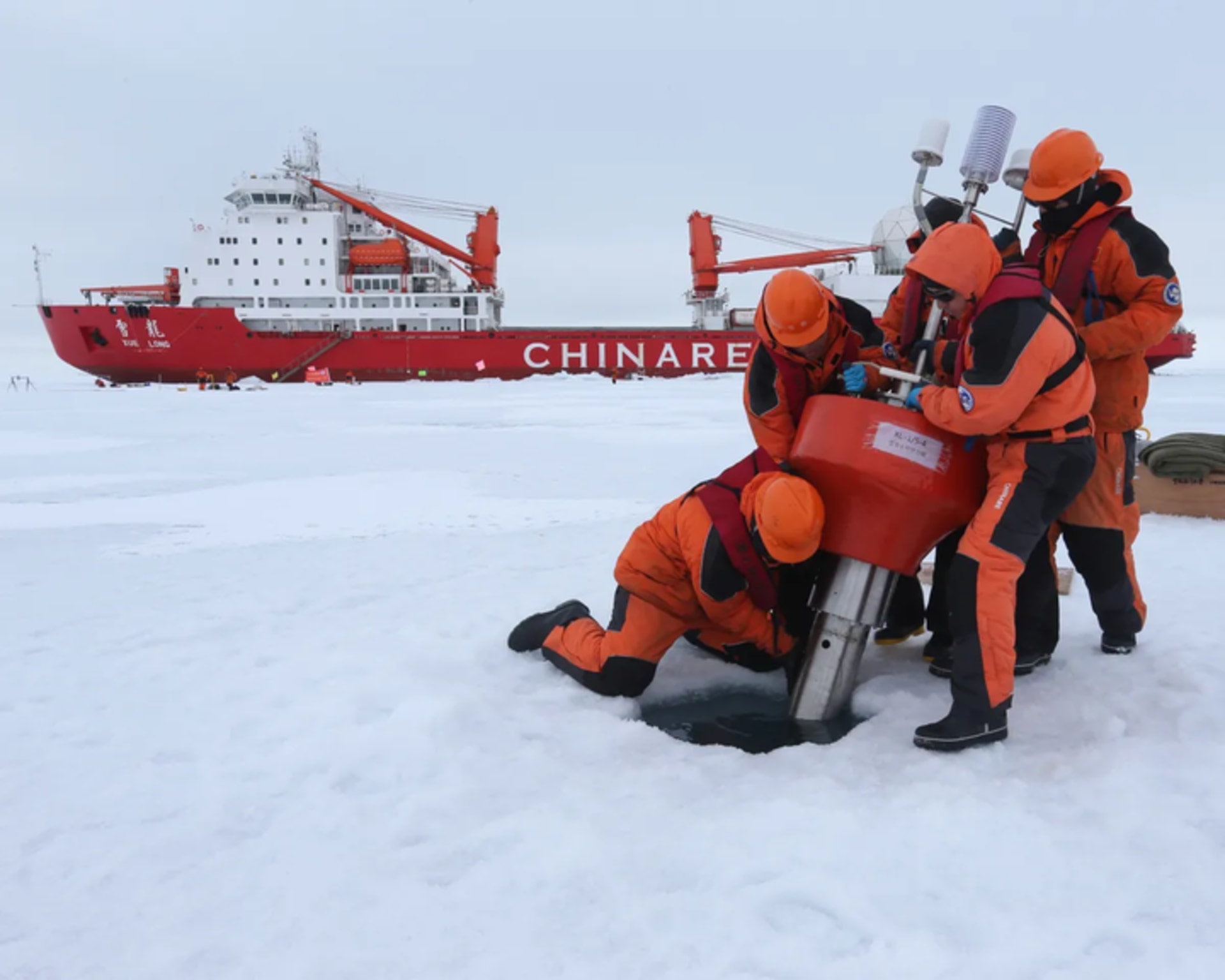 Chinese research team sets up oceanography equipment near the icebreaker Xuelong, or 'Snow Dragon”, in the Arctic Ocean.