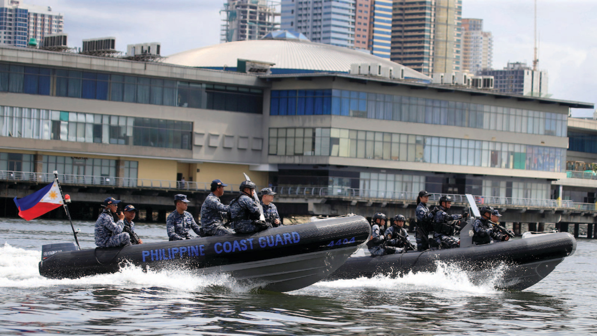 Members of the Philippine Coast Guard (PCG) Special Operations Group patrol the coast in Manila, Philippines
