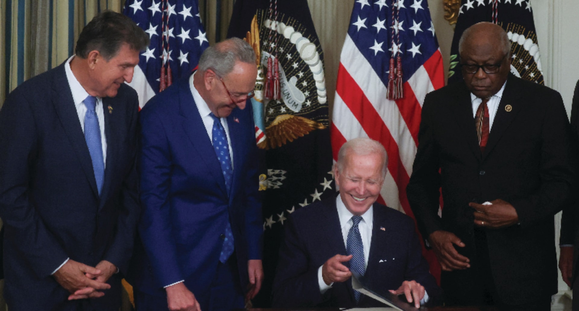 President Joe Biden smiles as he signs ”The Inflation Reduction Act of 2022 into law during a ceremony at the White House on August 16, 2022.