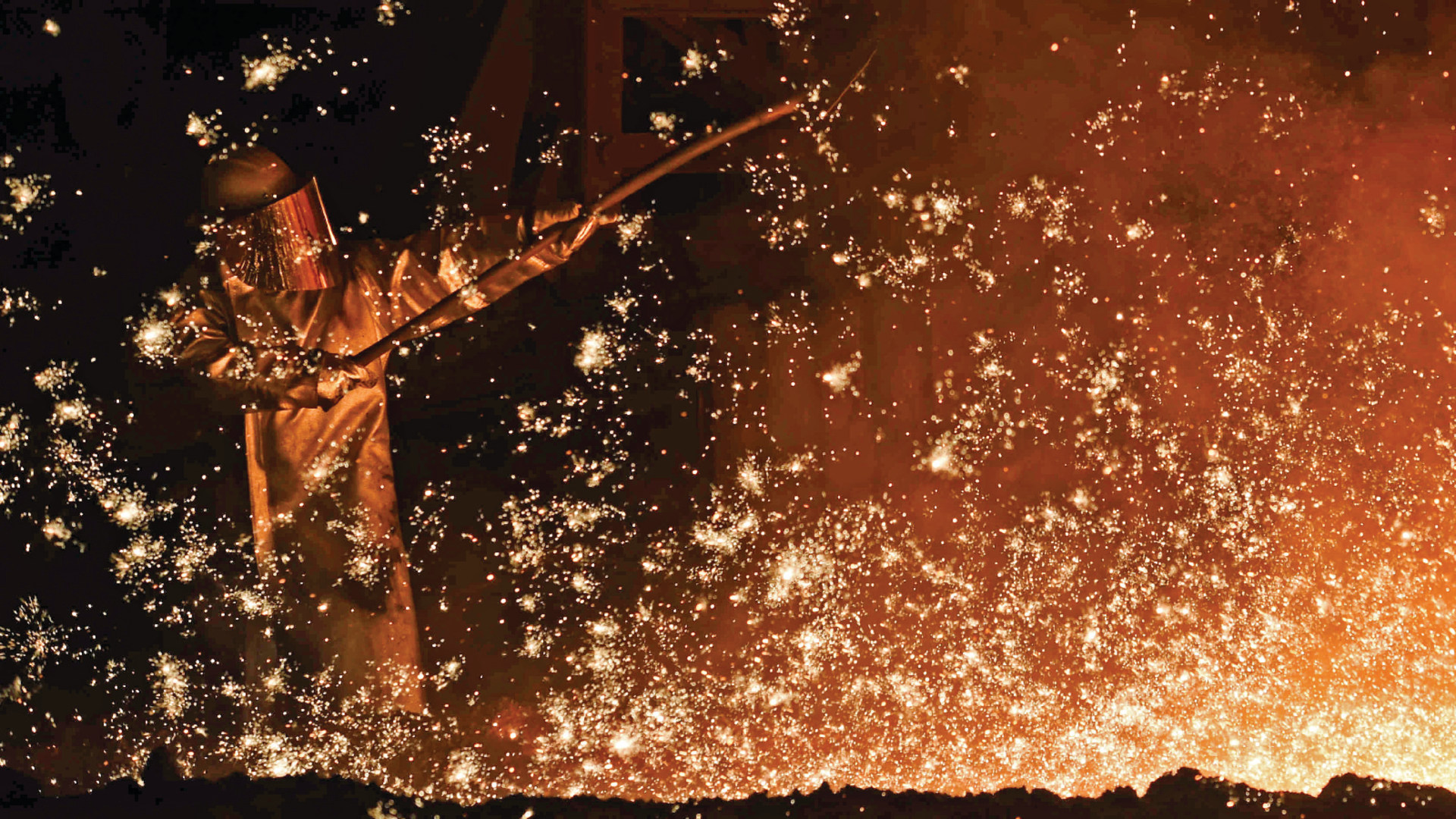 A steelworker at a furnace at a steel company plant in Salzgitter, Germany on March 17, 2015.