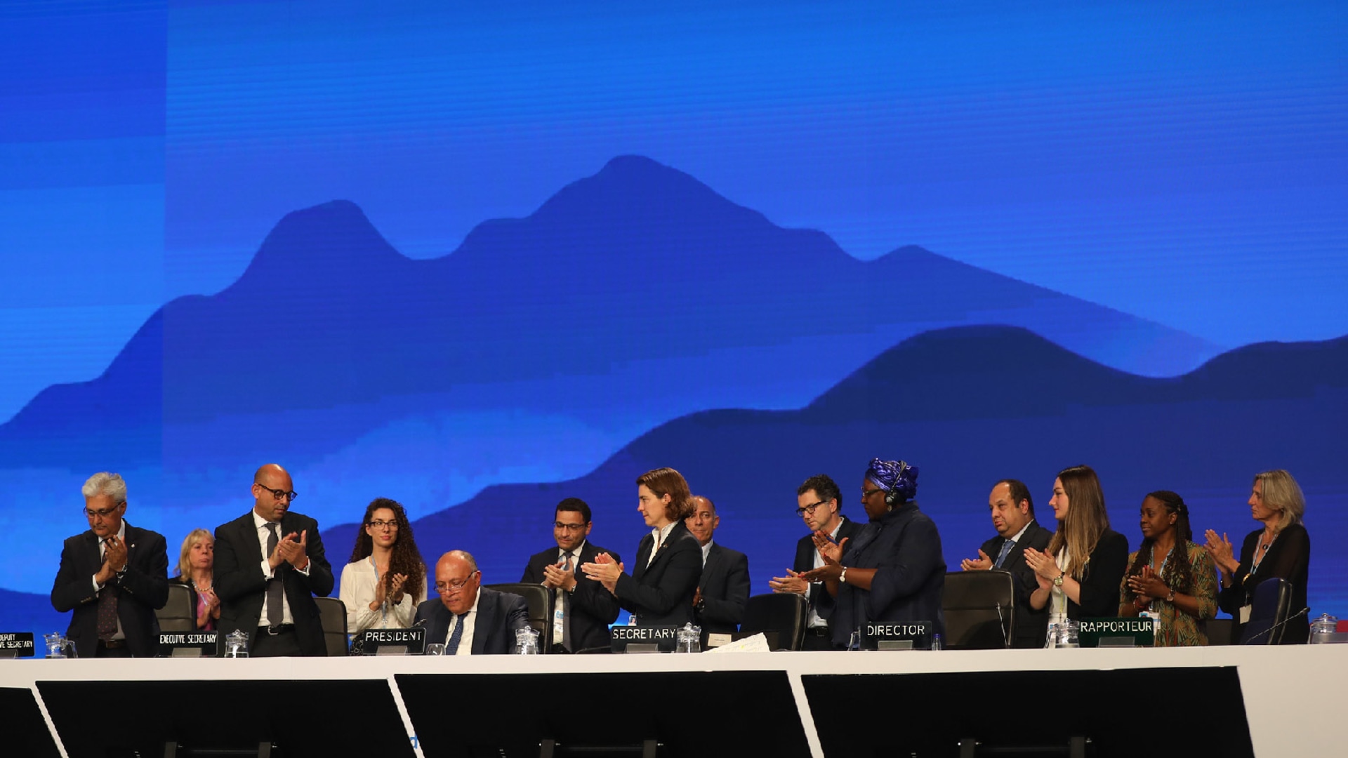 Delegates at the 27th Conference of Parties (COP) applauding after reaching a historic agreement to establish and implement a loss and damage fund.