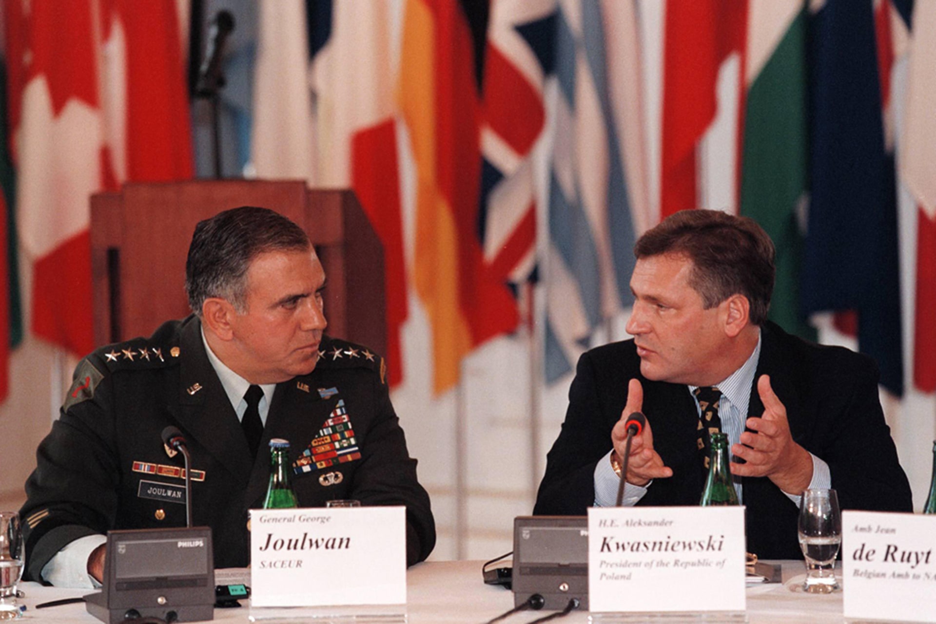 Polish President Aleksander Kwasniewski (right) makes a point during his speech while General George Joulwan, the supreme commander of allied forces in Europe, listens.