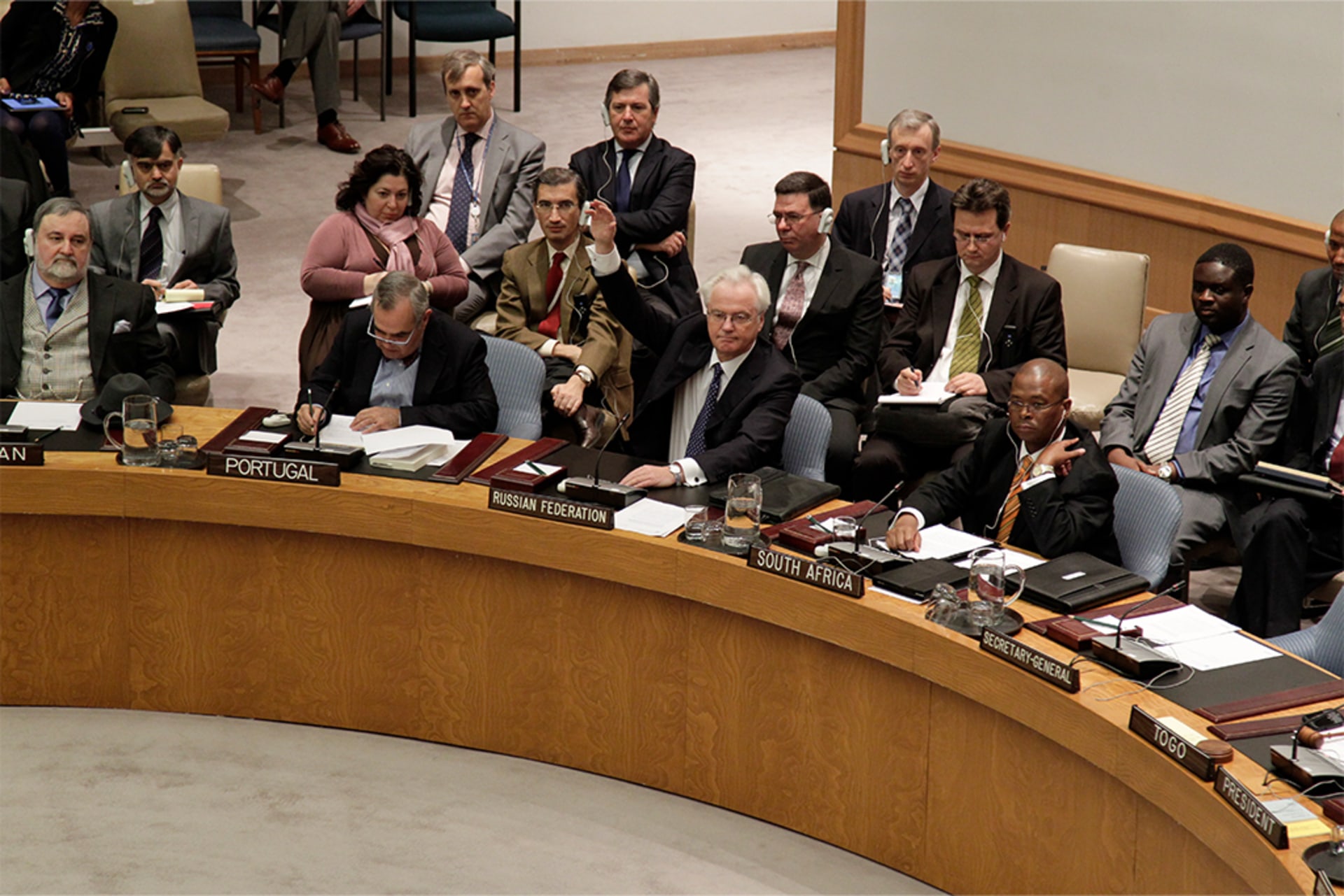 Vitaly I. Churkin (second from right), the Russian representative to the United Nations, vetoes a draft resolution on Syria at the UN headquarters in New York on February 4, 2012.