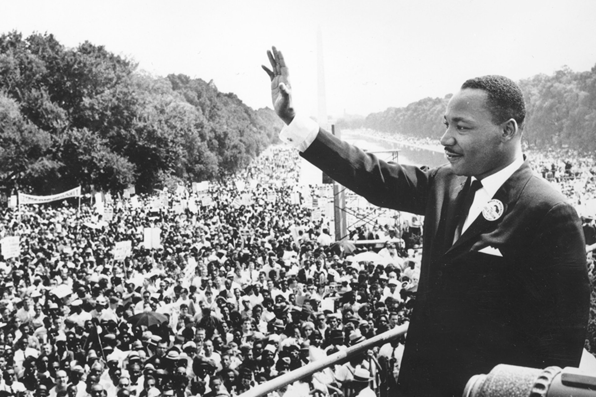 Civil rights leader Martin Luther King Jr. waves at the crowd during the March on Washington at the Lincoln Memorial in Washington, DC, on August 28, 1963.