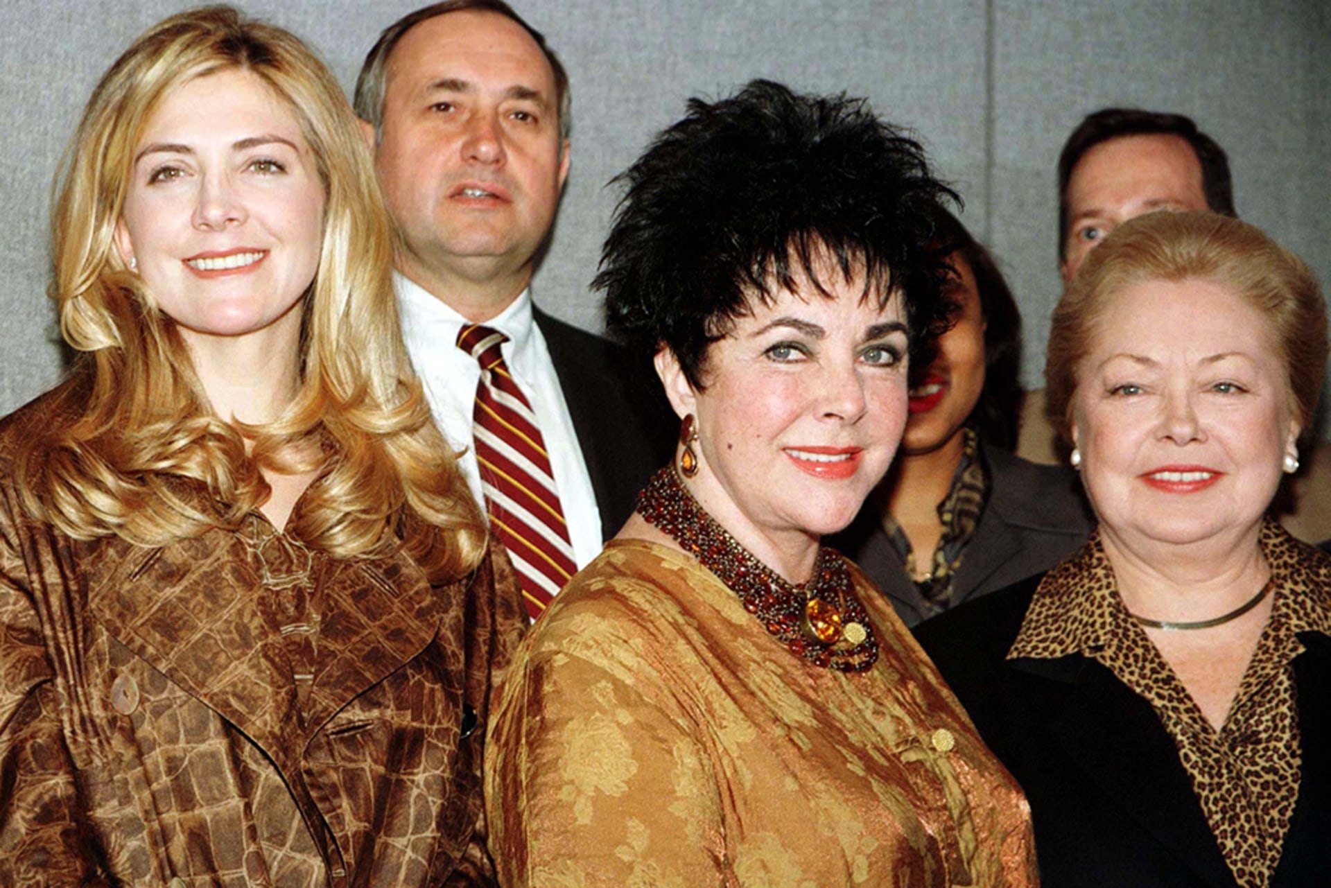 From left, actress Natasha Richardson, actress Elizabeth Taylor and Mathilde Krim, chair of the American Foundation for AIDS Research, pose at the United Nations in New York on December 2, 1996, before a World AIDS Day luncheon.
