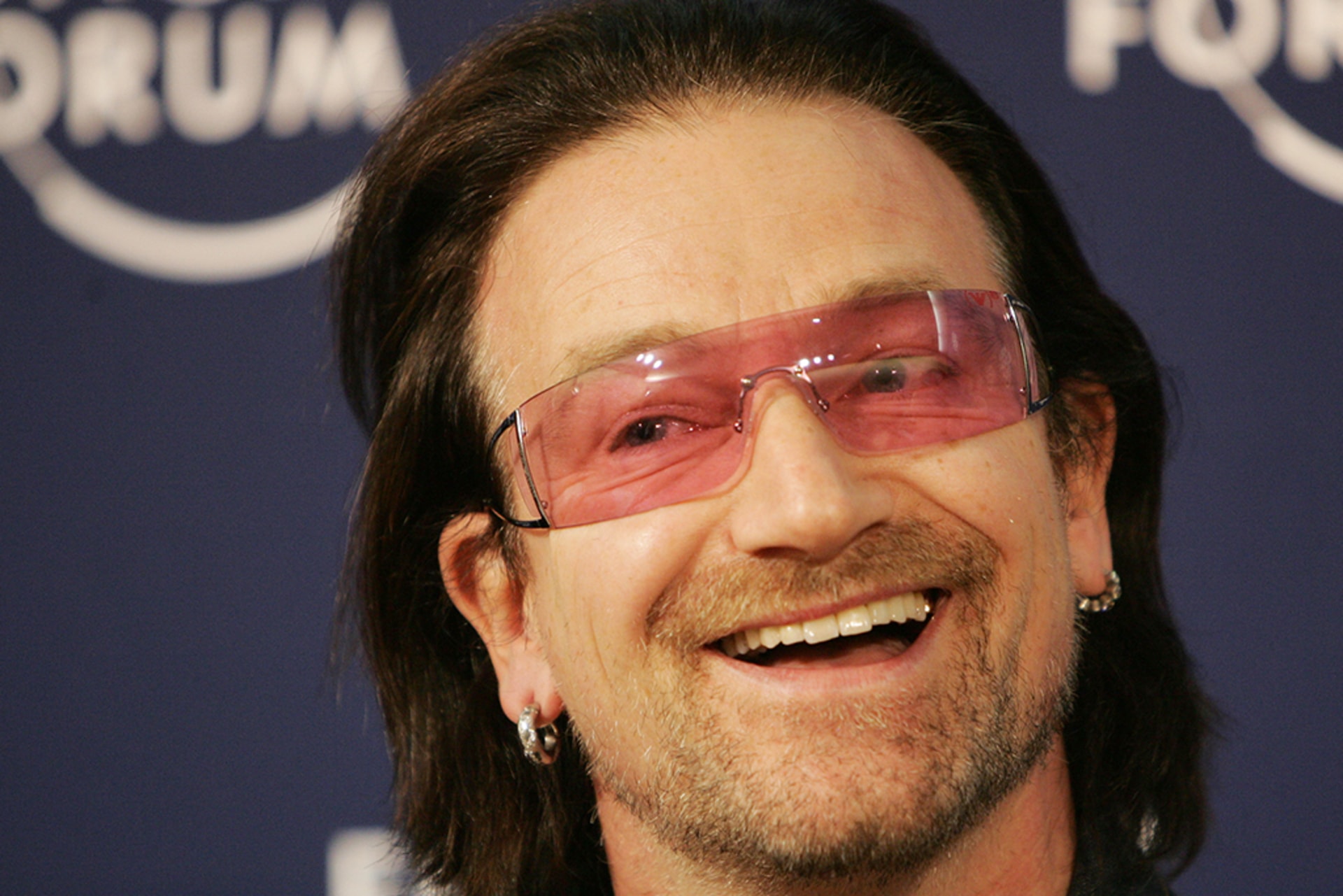 Irish singer Bono smiles during the launch of an initiative to help fund the Global Fund to Fight AIDS, Tuberculosis and Malaria at the World Economic Forum in Davos, Switzerland, on January 26, 2006.