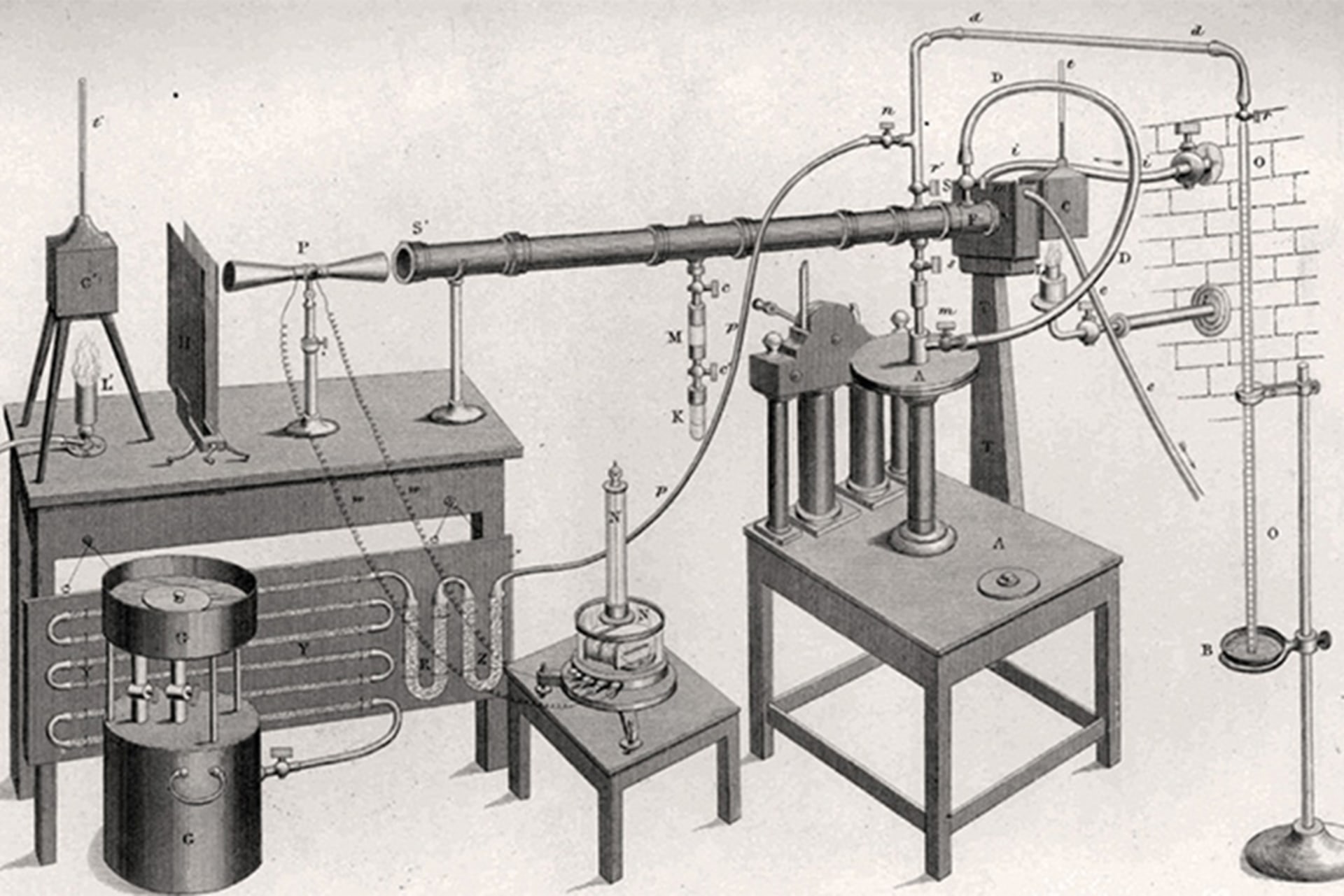 An illustration of John Tyndall's radiant heat measurement system. There are various tables, pipes, and tubes used to construct the system.