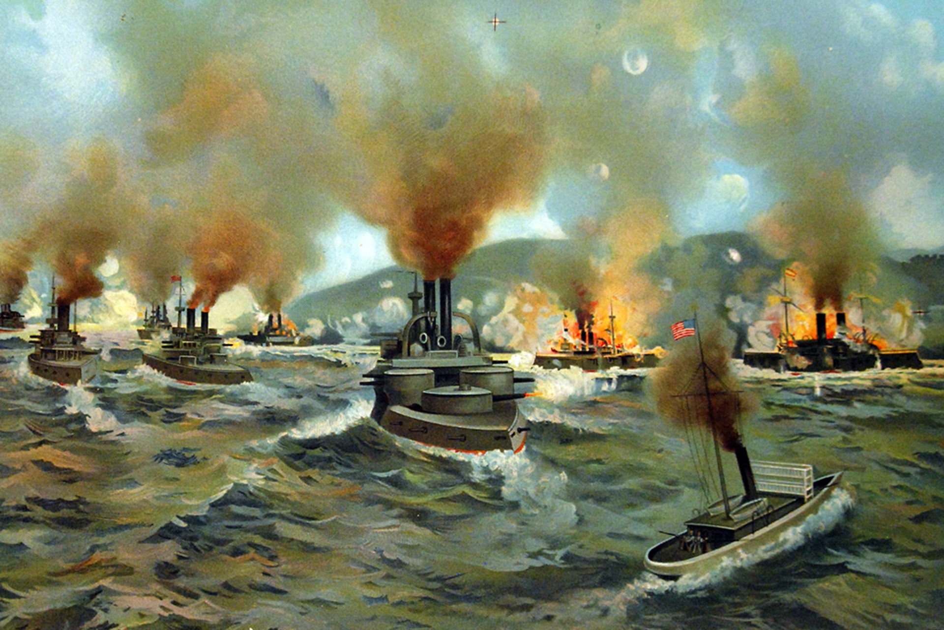 A painting of the naval Battle of Santiago de Cuba. Multiple ships are pictured, with some hit with fire.