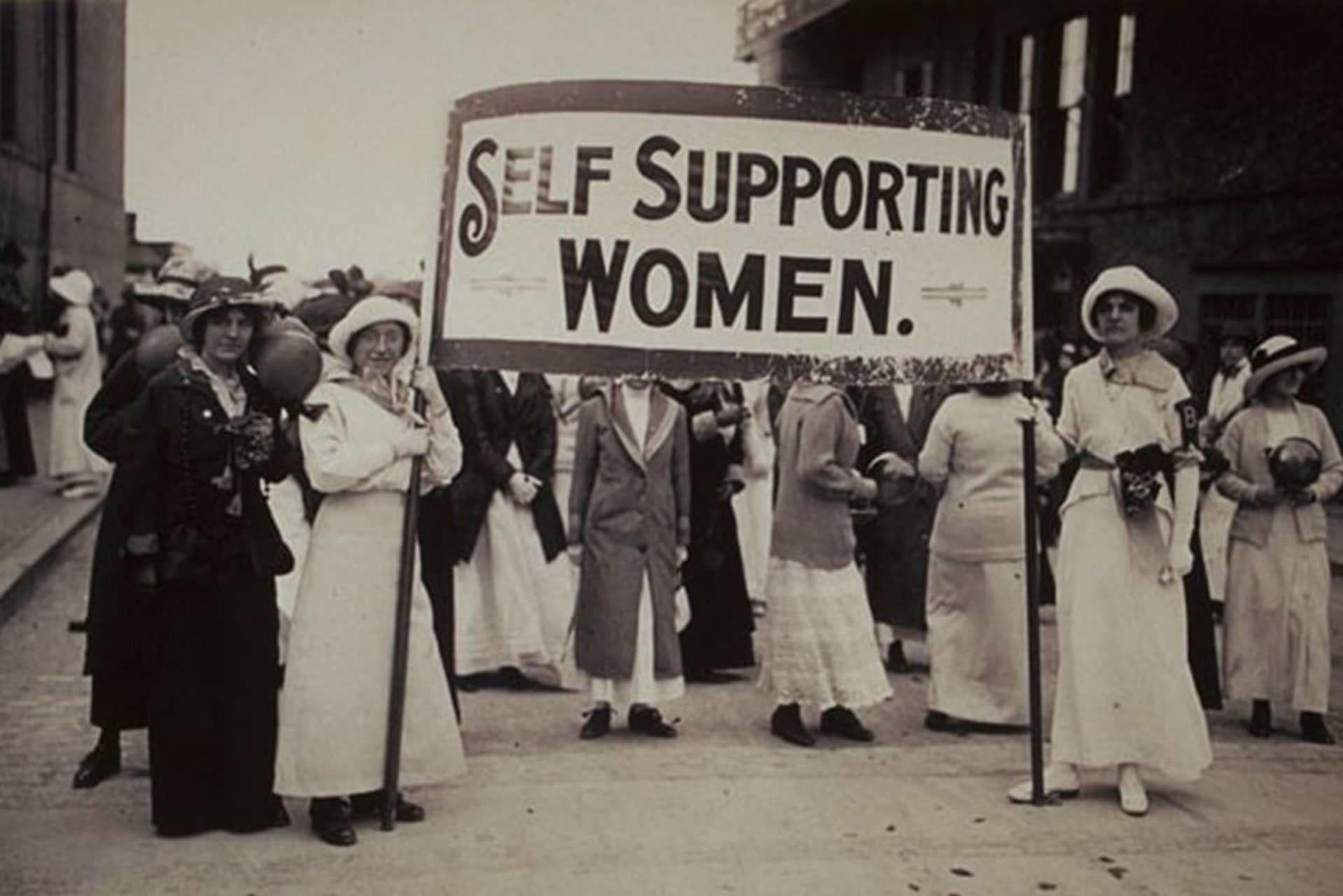 Young women hold a sign that reads “Self Supporting Women” at a rally in Boston, Massachusetts, in May 2, 1914.