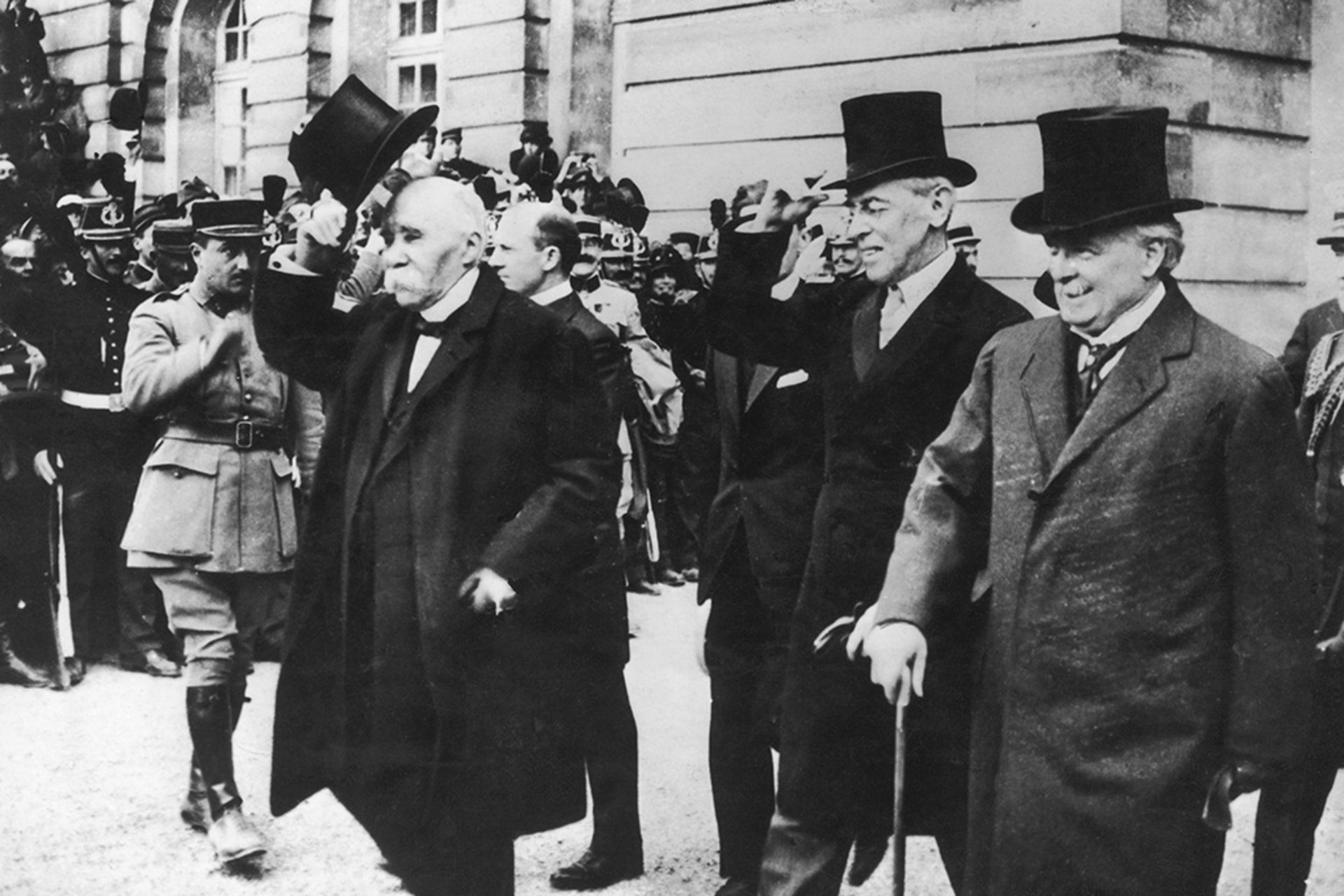 British Prime Minister David Lloyd George (right), U.S. President Woodrow Wilson (center), and French Prime Minister Georges Clemenceau attend the peace conference at the end of World War I on June 1, 1919.
