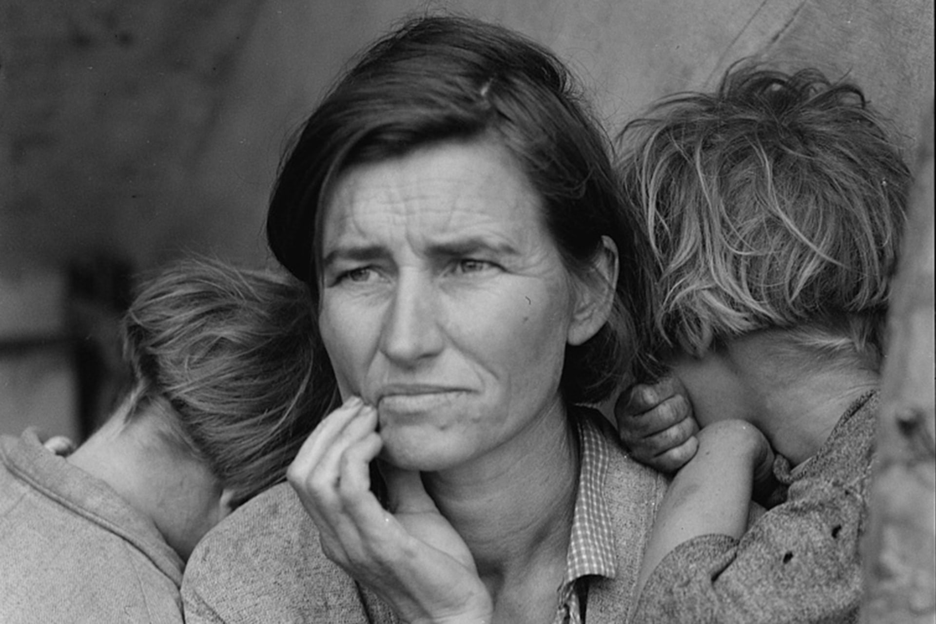 A mother with three of her children at a pea-pickers' camp in Nipomo, California in March 1936.