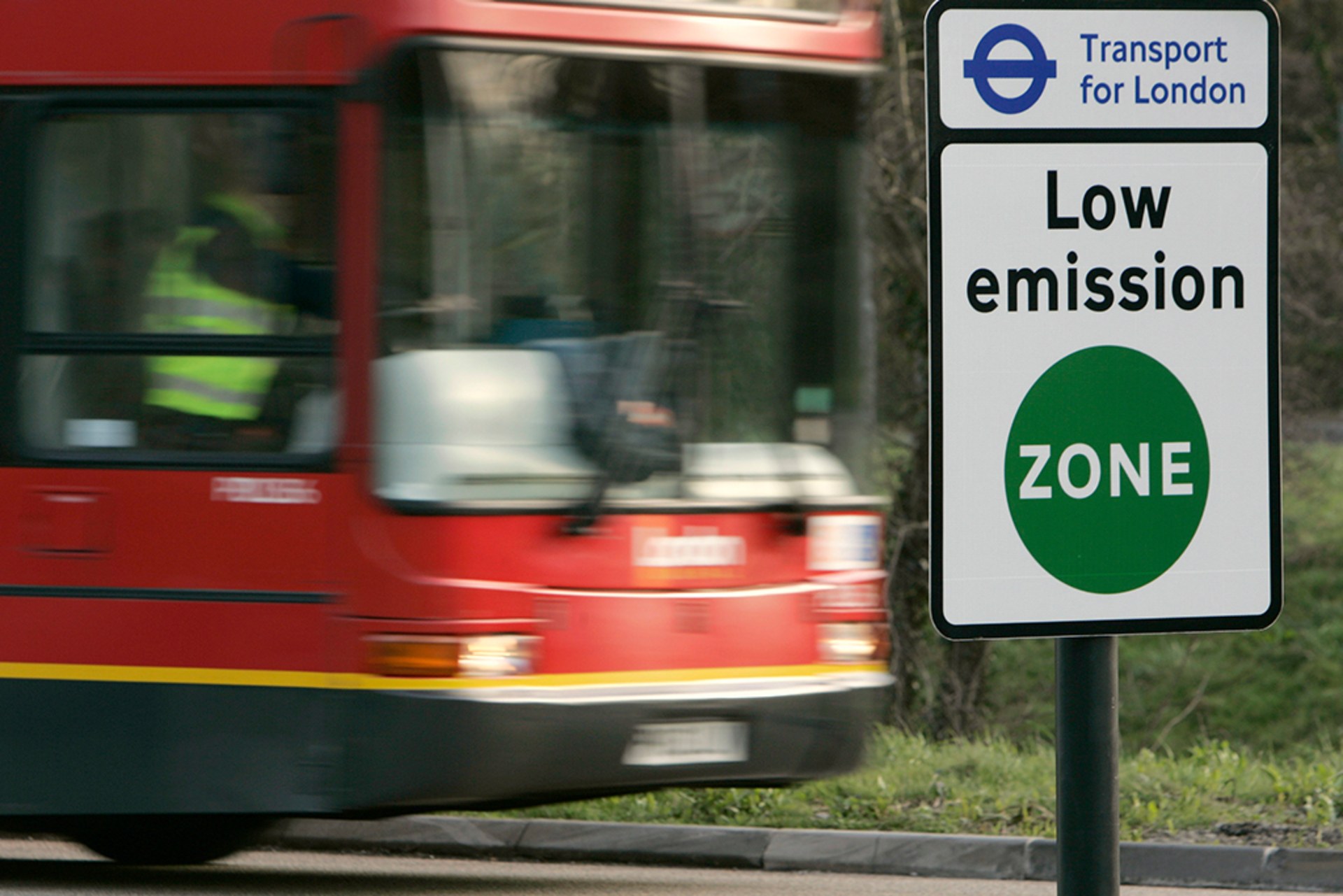 A vehicle passes a sign for the new Low Emissions Zone at Coulsdon in London February 3, 2008.