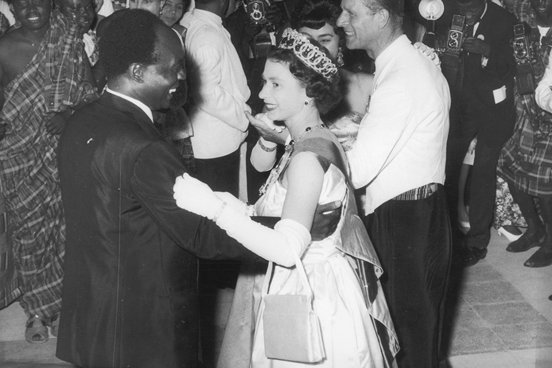 Queen Elizabeth II of Great Britain dances with President Kwame Nkrumah of Ghana, during her visit to Accra, Ghana.