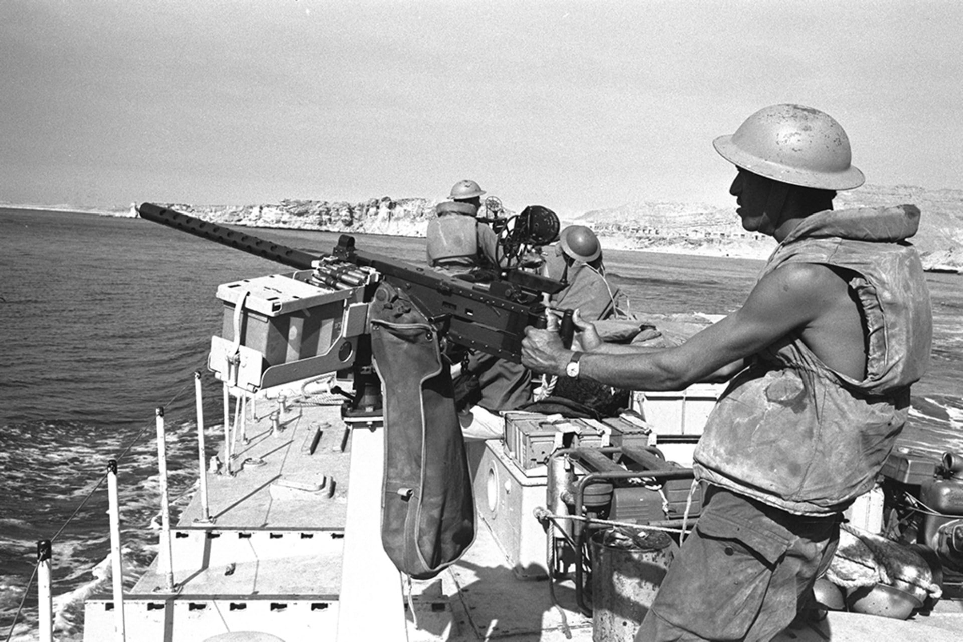 A soldier aims a gun on an Israeli gun boat that passes through the Straits of Tiran near Sharm El Sheikh.