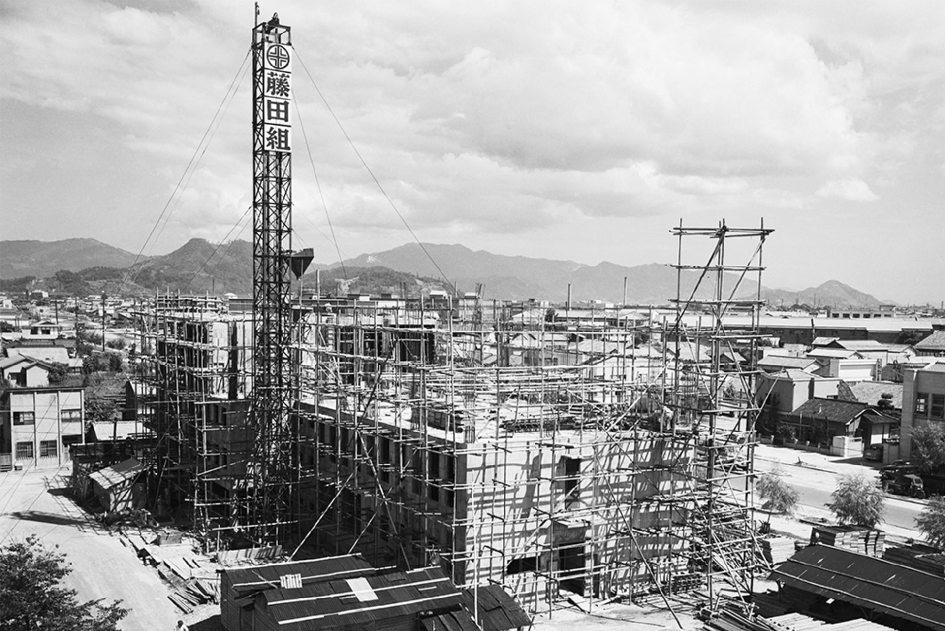 A war-torn building, destroyed by the first atomic bomb, being reconstructed in Japan.