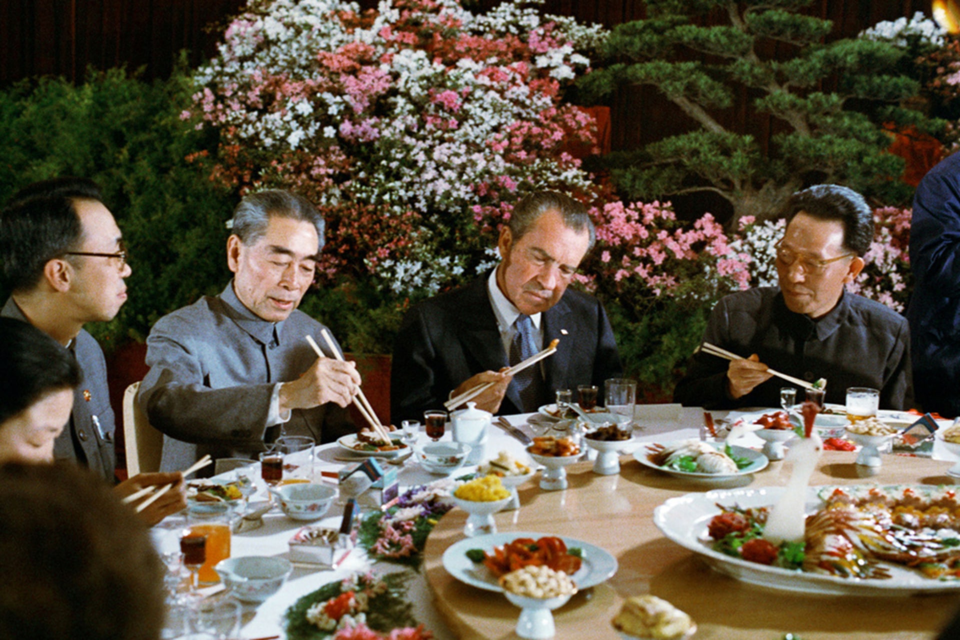 U.S. President Richard Nixon uses chopsticks during a Chinese state banquet given in his honor with Chinese Premier Zhou Enlai in Hangzhou, China.
