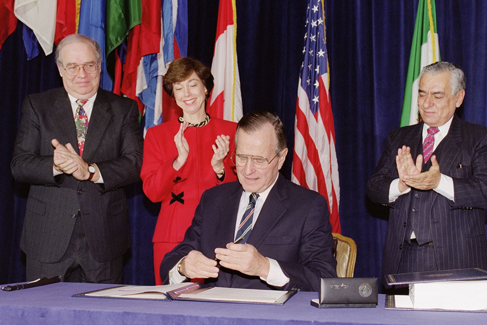 U.S. President George Bush caps his pen after signing the North American Free Trade Agreement at the Organization of American States headquarters.