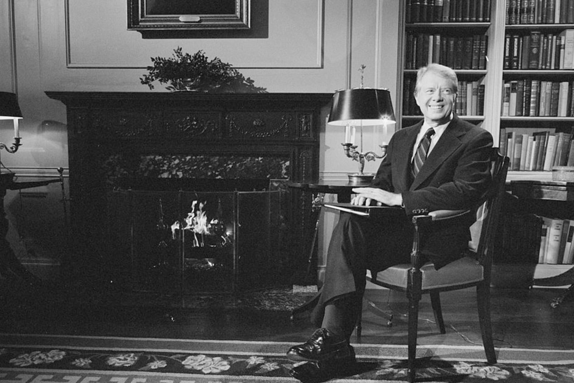 President Jimmy Carter sits on a chair at the White House during a fireside chat on the Panama Canal Treaty in Washington, D.C.