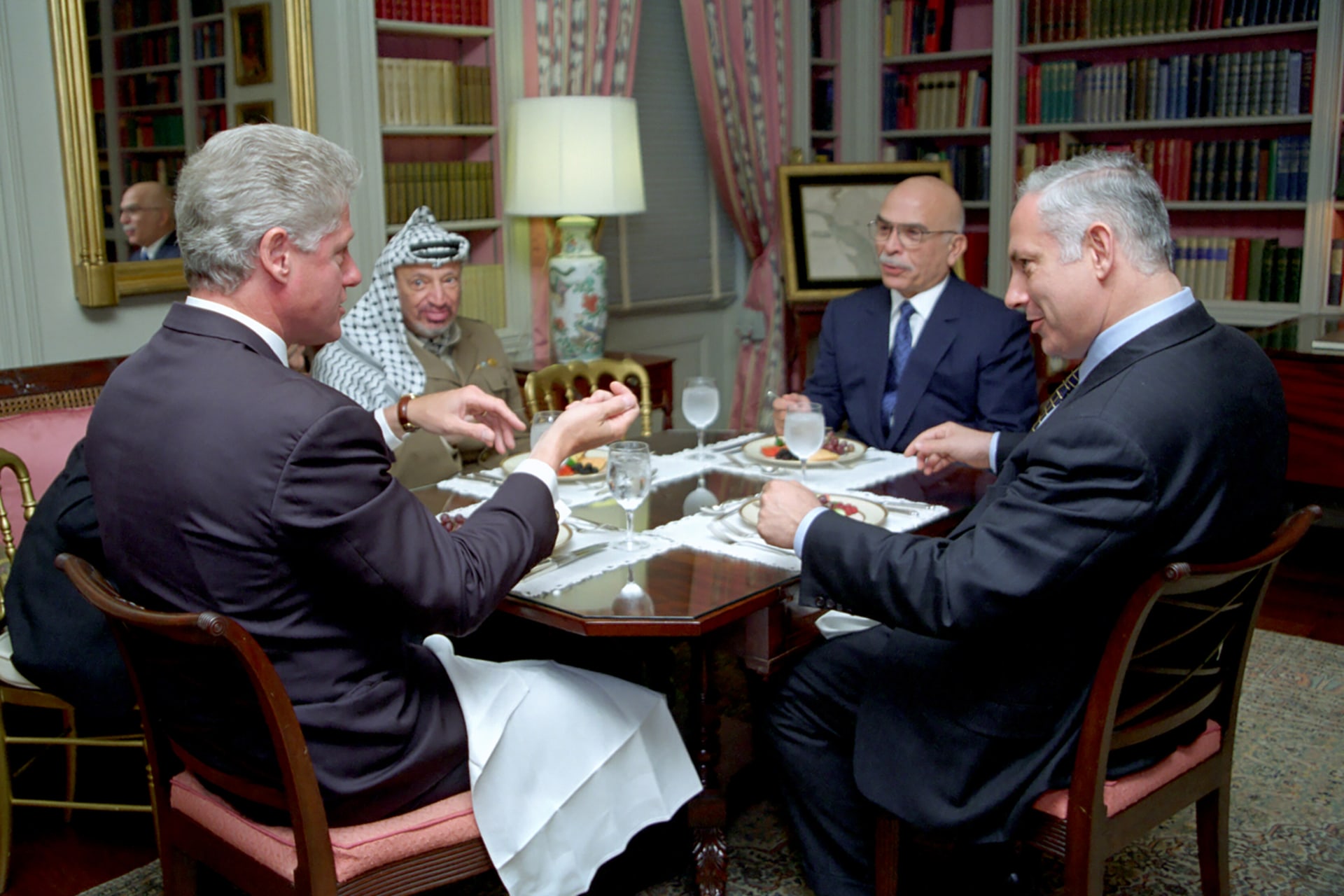 President Clinton has lunch with King Hussein of Jordan, Prime Minister Benjamin Netanyahu of Israel and Chairman Yasser Arafat of the Palestinian Authority in the White House library.
