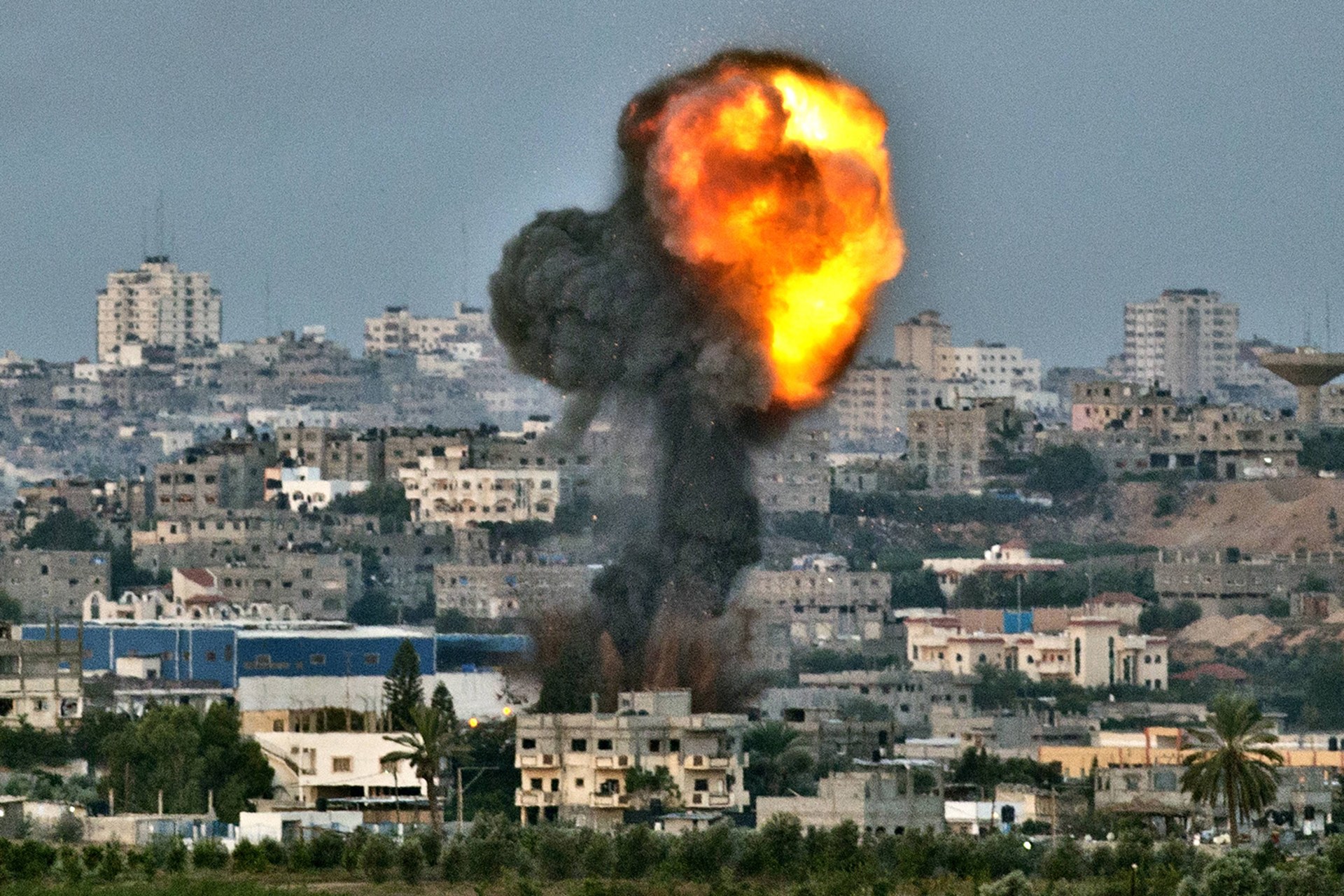 Fiery smoke billows from a spot targeted by an Israeli air strike inside the Gaza strip.
