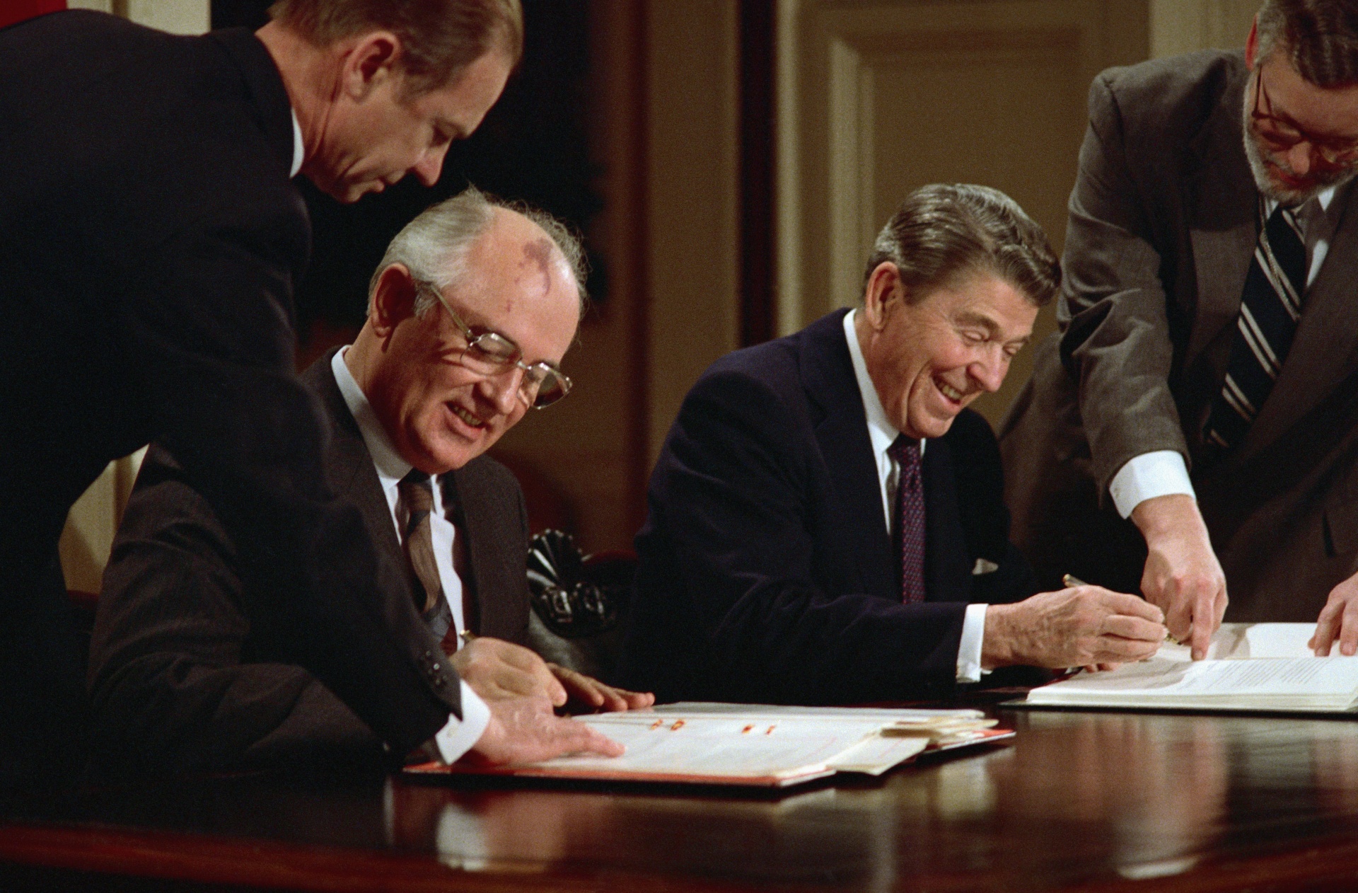 President Ronald Reagan and Soviet leader Mikhail Gorbachev signing the arms control agreement banning the use of intermediate-range nuclear missiles, the Intermediate Nuclear Forces Reduction Treaty, Washington DC, 8th December 1987.