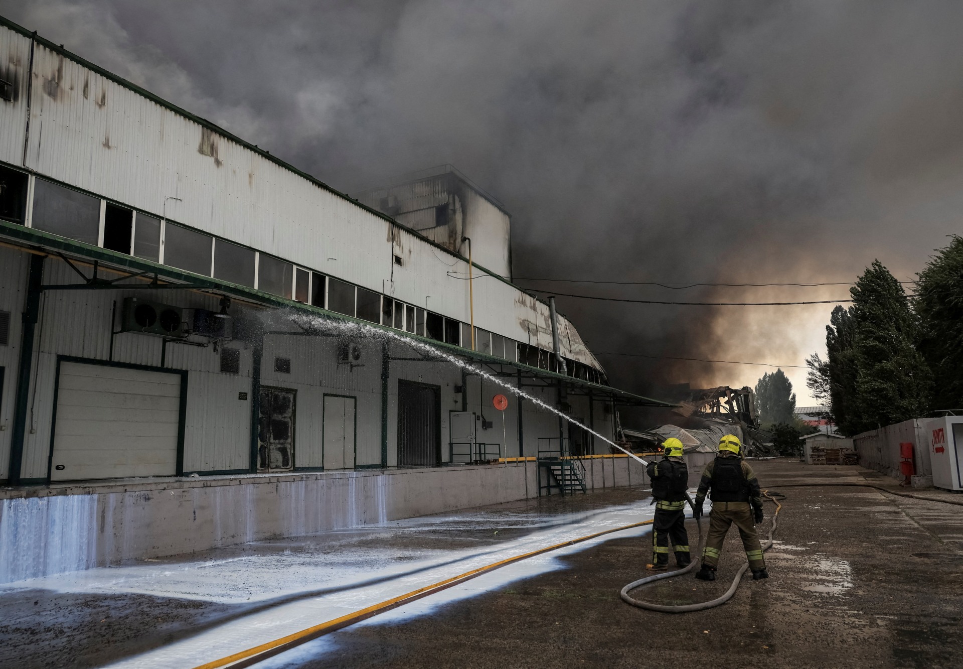 Firefighters work at the site a Russian drone strike, amid Russia's attack on Ukraine, near Odesa, Ukraine, on September 13, 2026.