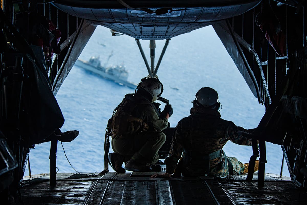 U.S. Marines observe the USS Bunker Hill from a helicopter during a simulated military exercise, on March 15, 2020 
