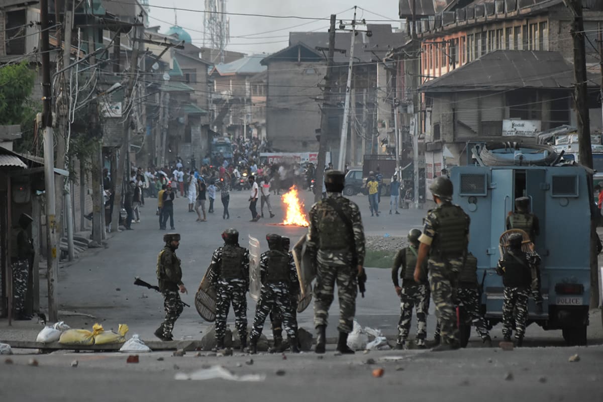 People in Srinagar clash with Indian forces after curfew was lifted, on September 2, 2021.