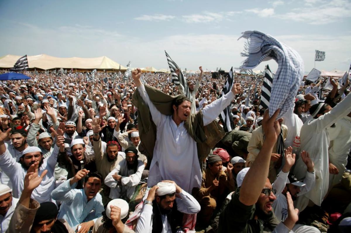 Supporters of the Jamiat Ulema-i-Islam-Fazl religious party react during Friday Prayers in Nowshera, Pakistan on April 7, 2017.