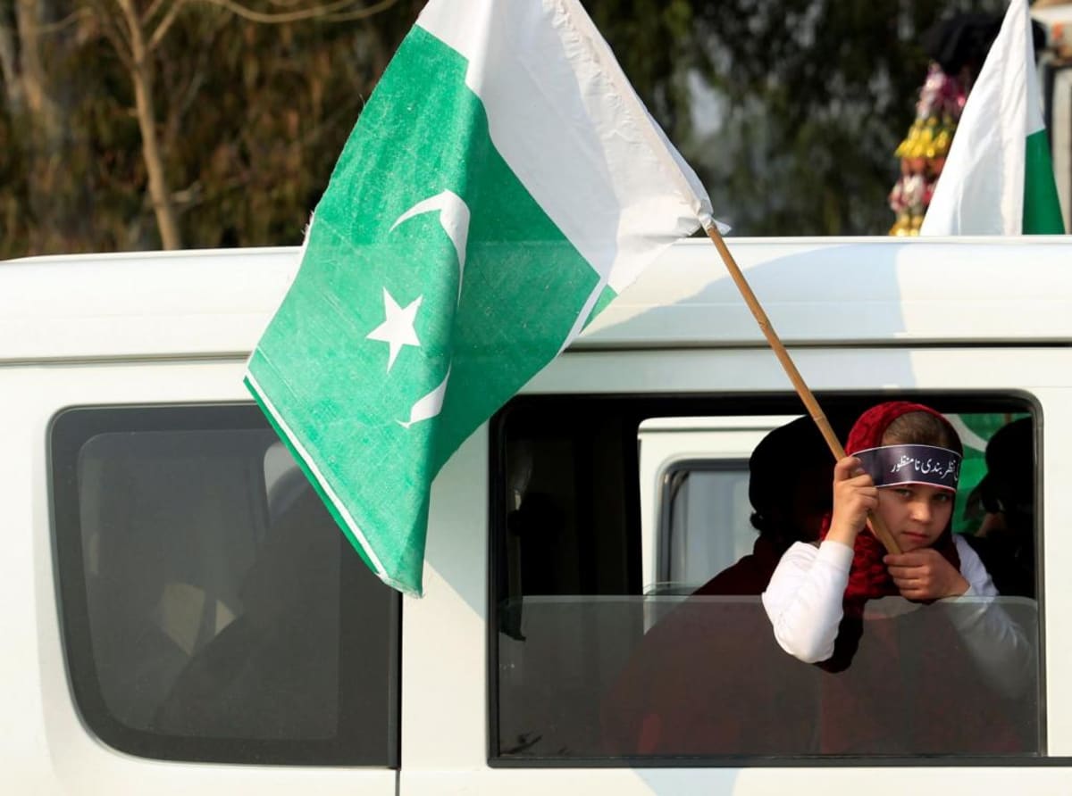 A girl holds a Pakistani flag as she takes part in a rally to mark Kashmir Solidarity Day in Islamabad, Pakistan on February 5, 2017.